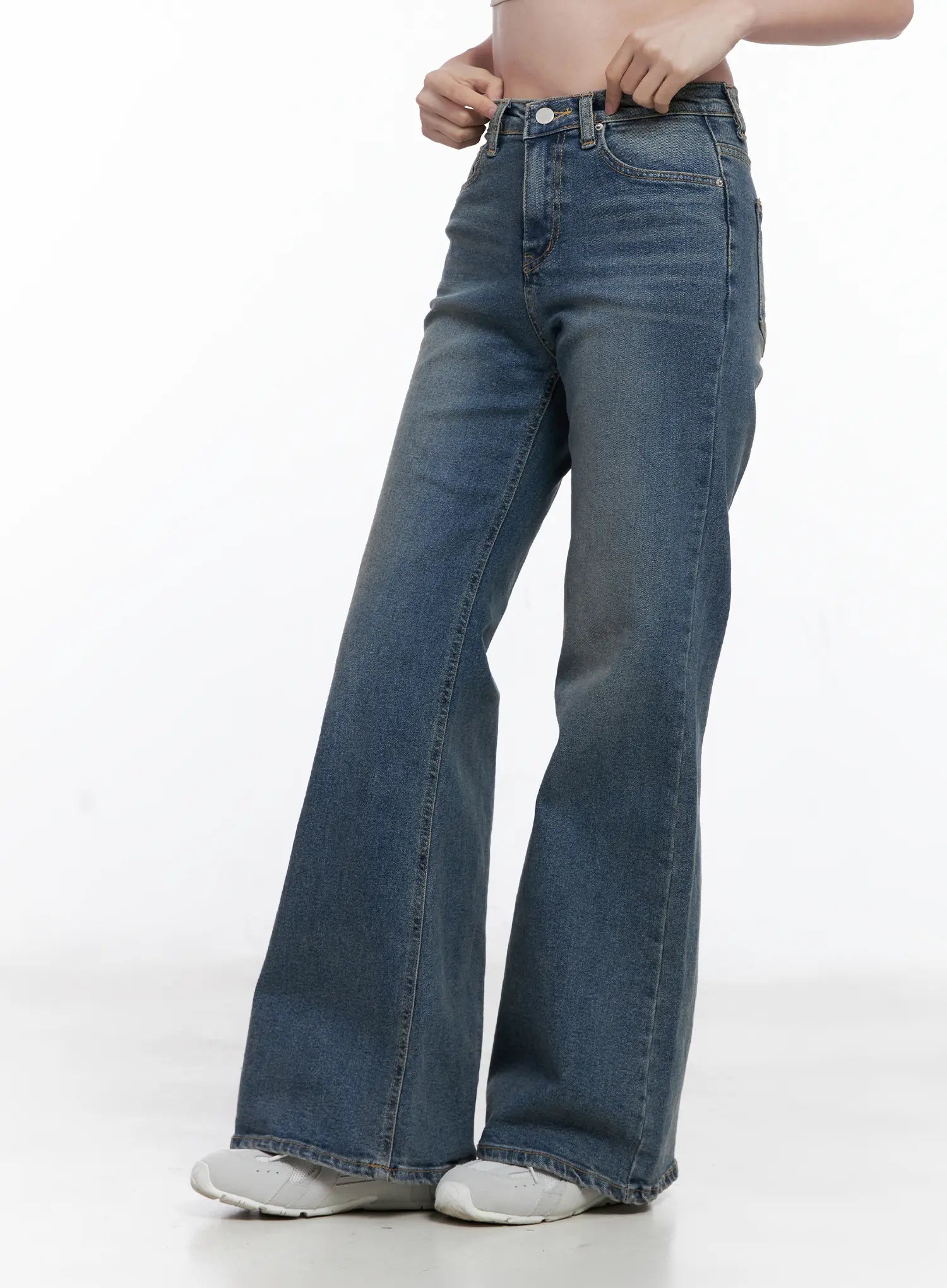 Juae High Waist Flare Jeans CG520 in blue, side view on model, showing flare silhouette from hip to hem, washed cotton-spandex, white sneakers.
