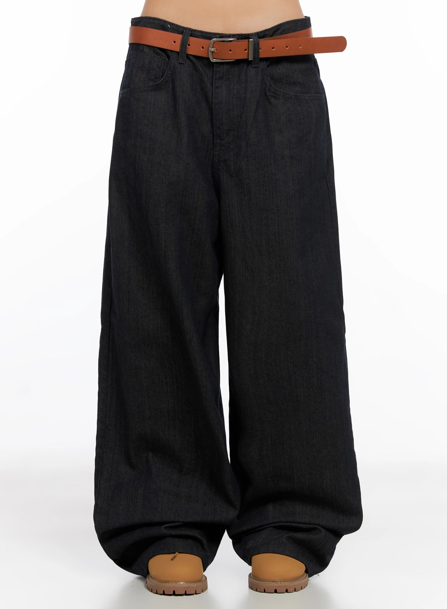Heidi Wide-Leg Jeans IG527 in dark blue, front view on model from waist down, extra-wide cotton denim legs pooling at hem, styled with brown leather belt and tan boots.