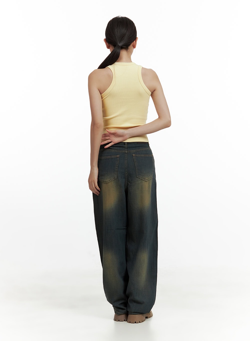 Vintage Washed Denim Baggy Pants CU420 in dark yellow, full back view on model, dual back pockets with contrast stitching and vintage washed finish, paired with yellow tank.