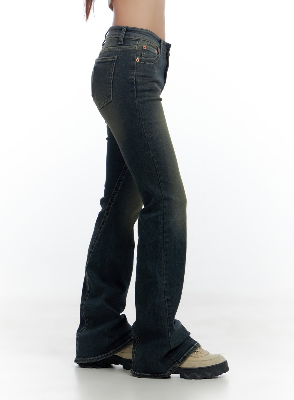 Aspen SlimFit Washed Bootcut Denim Jeans CS424 in dark blue, side close-up crop shot on model, showing low-rise waistband, coin pocket, copper rivet, slim hip-to-thigh fit, tall bootcut length.