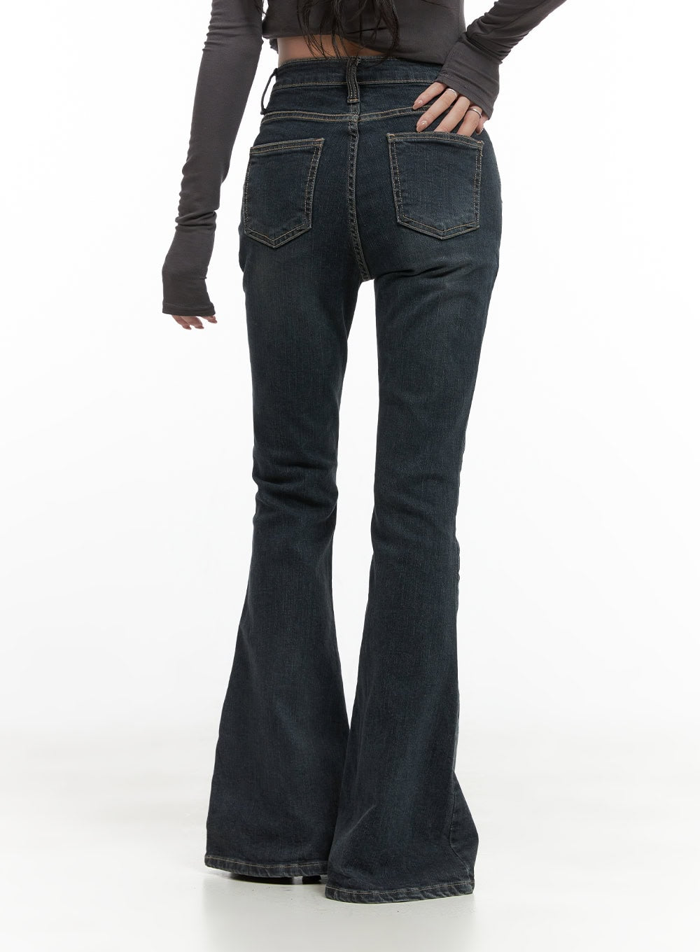 Zadie Slim Washed Denim Bootcut Jeans CG421 in dark blue, back close-up on model, showing dual back pockets with contrast topstitching, washed denim texture, and wide flare silhouette at hem.