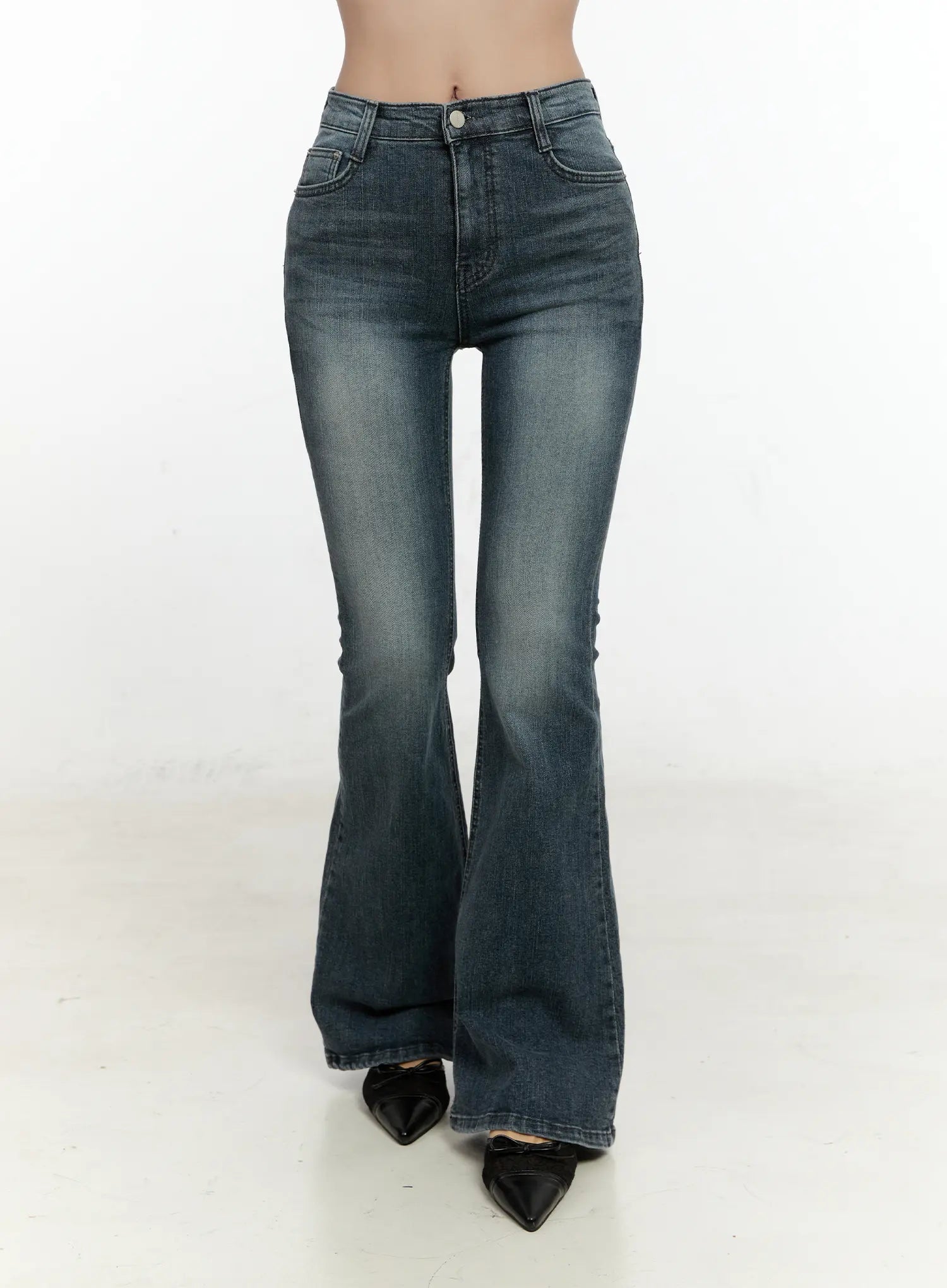 Marley Hip-Pad Denim Bootcut Jeans CN506 in dark blue, front headless crop shot on model, high-rise waistband with single button, slim fit through thigh flaring to bootcut hem, washed denim.