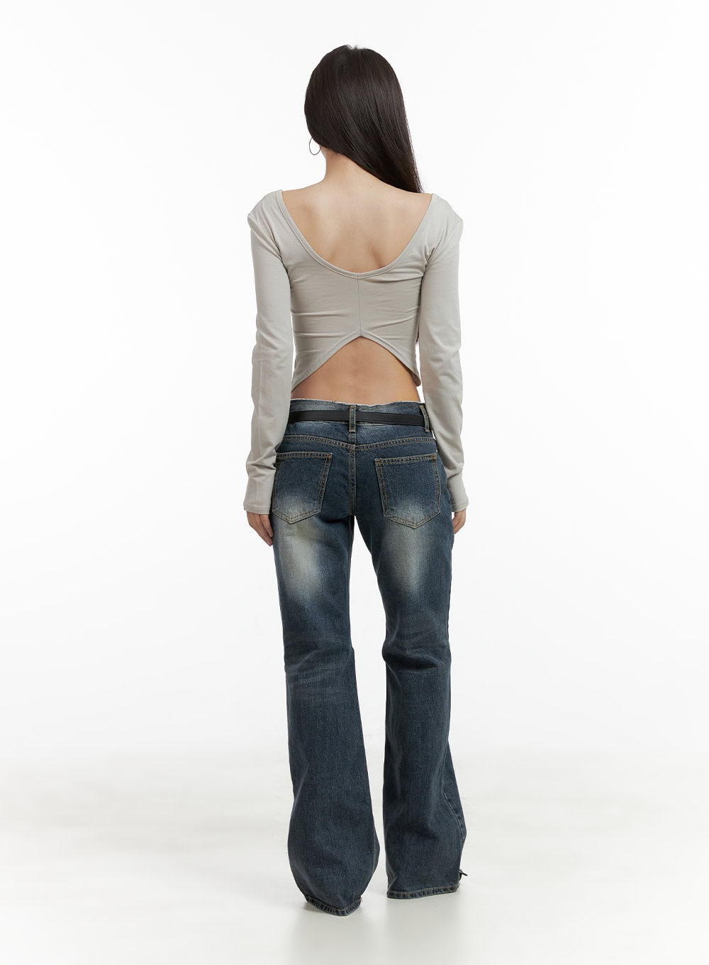 Low Rise Front Seam Bootcut Jeans CL417 in dark blue, full-body back shot on model, back pocket detail and bootcut flare hem, paired with open-back beige crop top and black belt.
