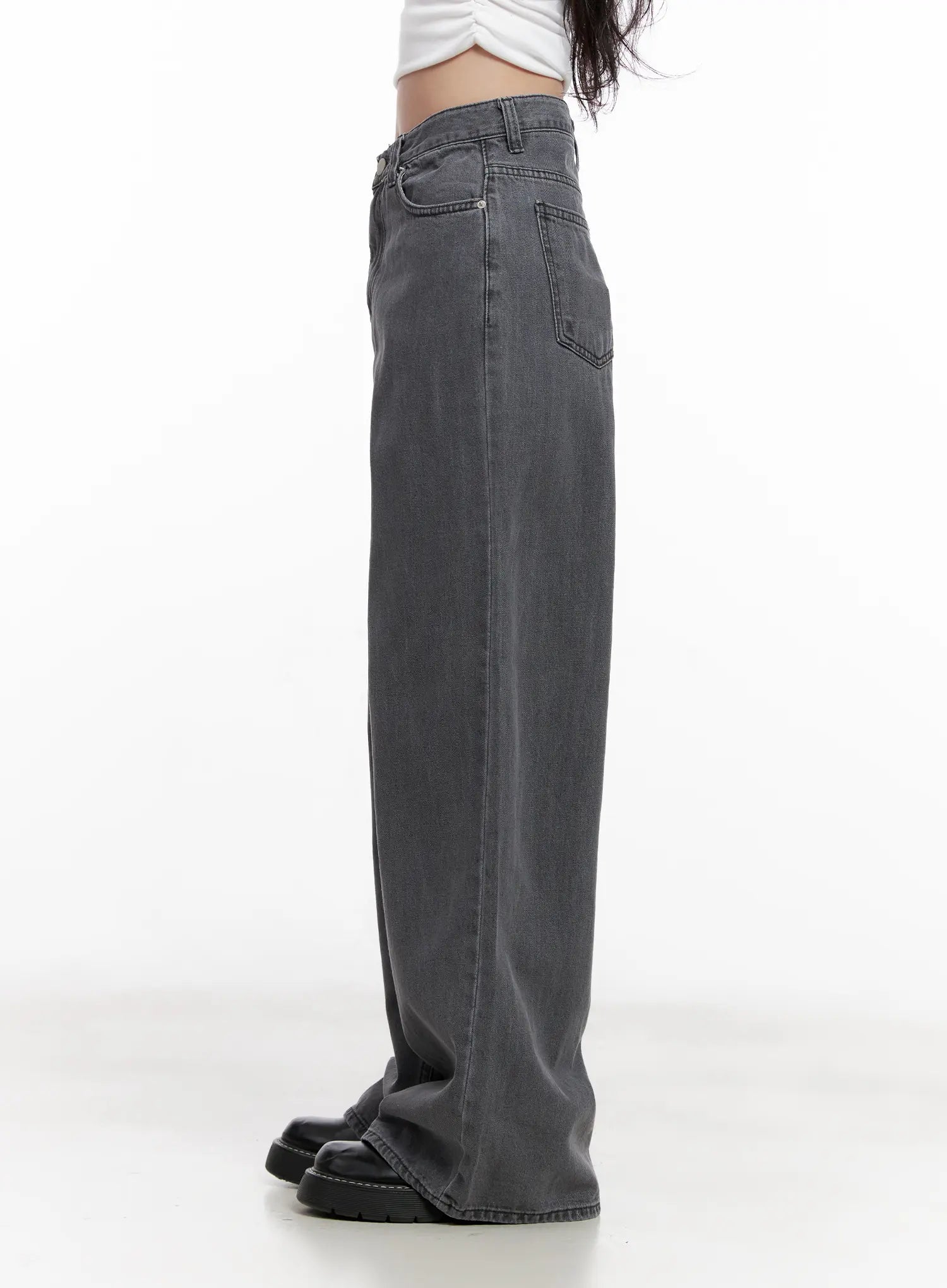 Jiyeon Dark Gray Denim Jeans CL516 in dark gray, side profile product shot on model, long wide-leg silhouette with straight hem pooling over black platform loafers, white crop top.