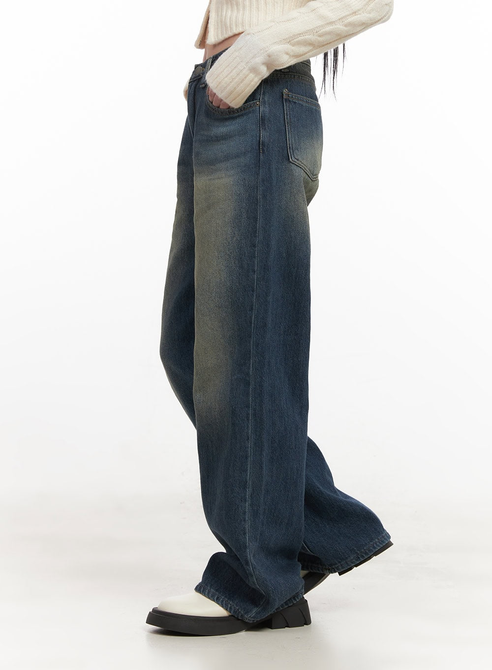 Audrey Washed Wide-Leg Jeans CJ516 in dark blue, side close-up on model, highlighting washed yellow-toned fading along leg seam, wide cotton denim with relaxed drape and hem break.