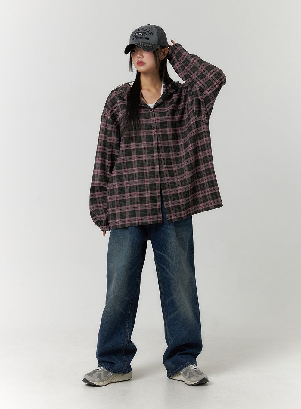 Wide Leg Washed Denim Jeans CF407 in blue, full front view on model with arm raised, wide-fit washed denim with subtle fading, paired with plaid overshirt, white tee, and cap.