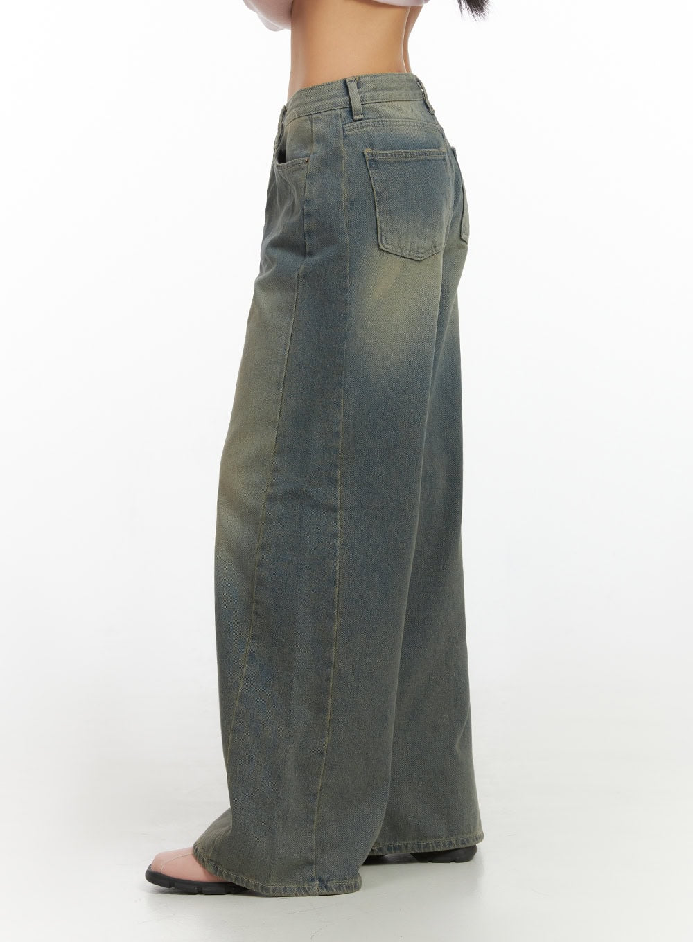 Inez Washed Denim Wide Leg Jeans IS427 in vintage green, side view close-up on model, back pocket detail and amber-toned faded wash, floor-grazing wide leg silhouette.