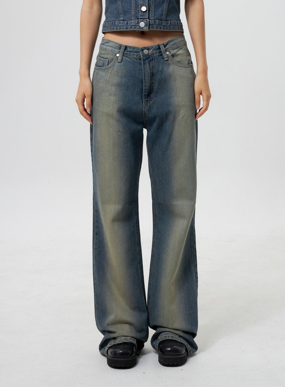 Low Rise Wide Leg Jeans CY323 in vintage blue, front mid-shot on model, low-rise waistband detail with single silver button, wide-leg denim with yellow-green fade wash, paired with denim crop top.