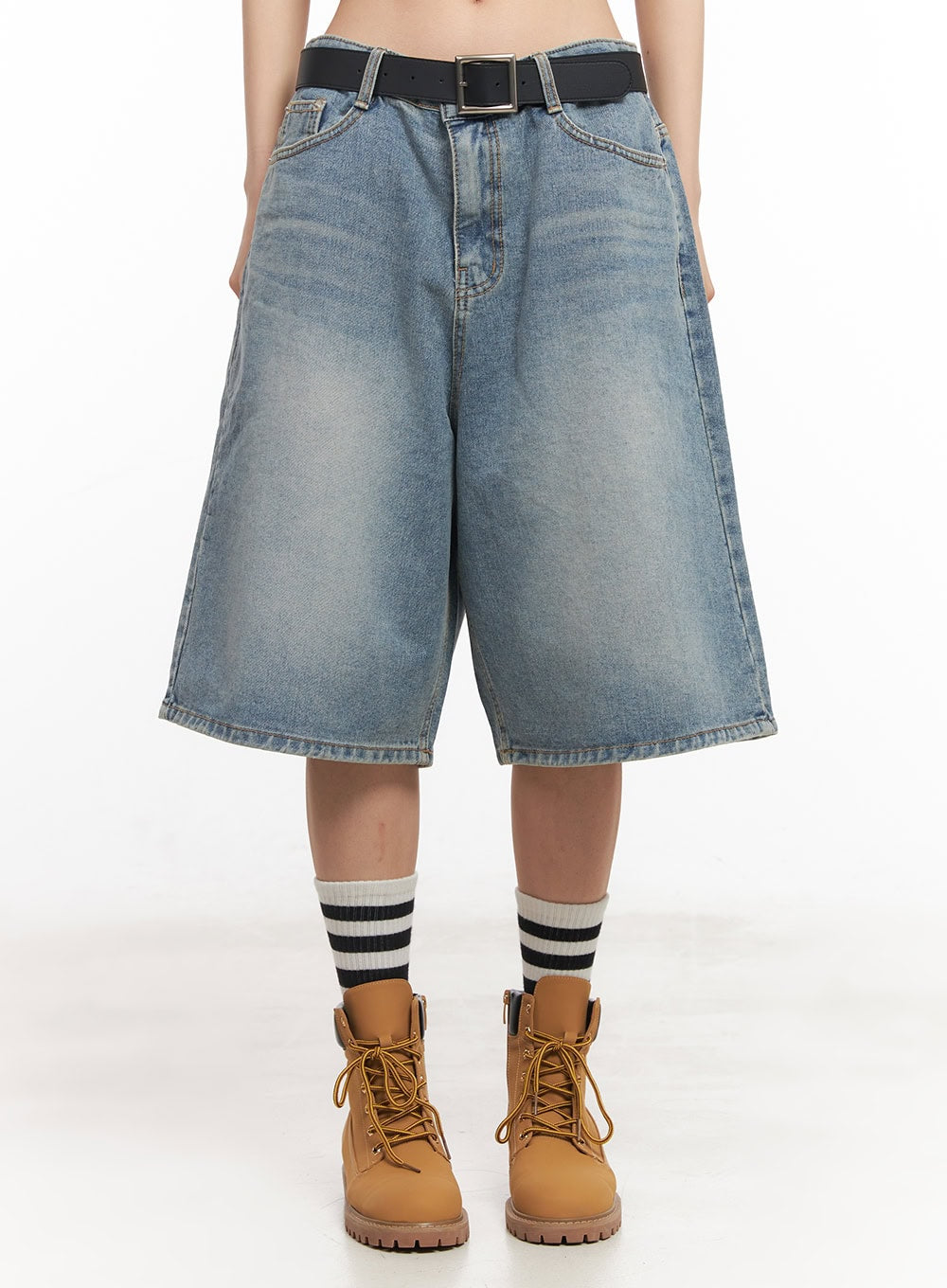 Washed Baggy Jorts IY529 in light blue, front waist-down close-up on model, wide baggy midi denim with visible faded wash, black belt, front pockets, worn with striped socks and boots.