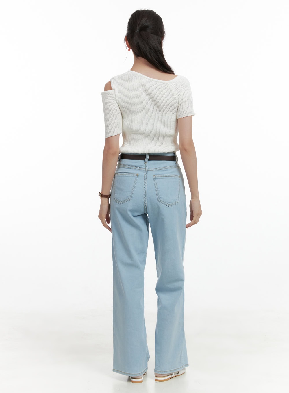 Washed Low Rise Loose Straight Jeans OL416 in light blue, back close-up shot on model, showing dual back pockets, low rise waistband with belt loops, and wide straight leg in washed cotton denim.