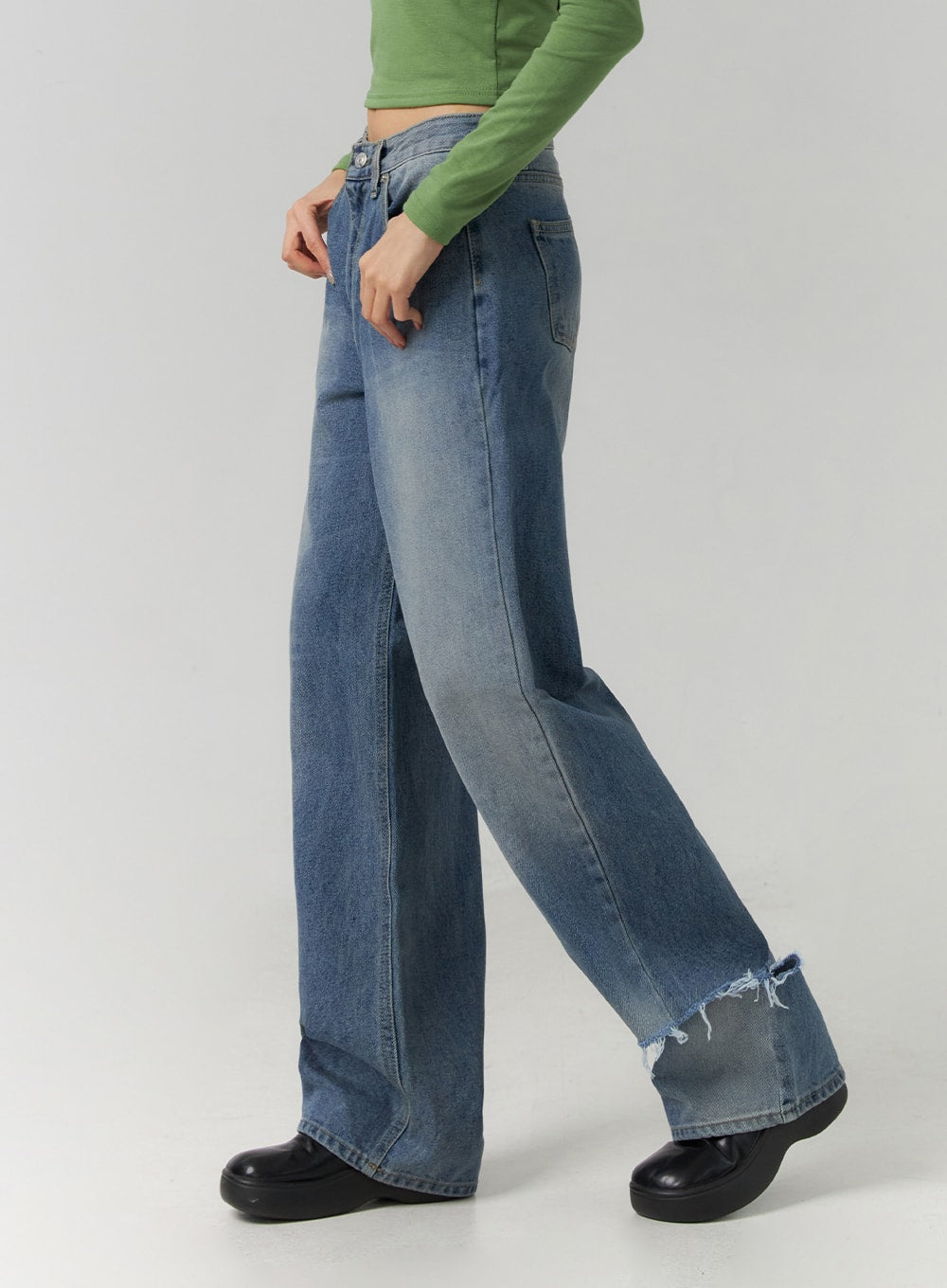 Ripped Straight Leg Jeans CD308 in blue, side close-up on model, wide-leg washed denim silhouette highlighting destroyed frayed hem and faded wash gradient along the leg.