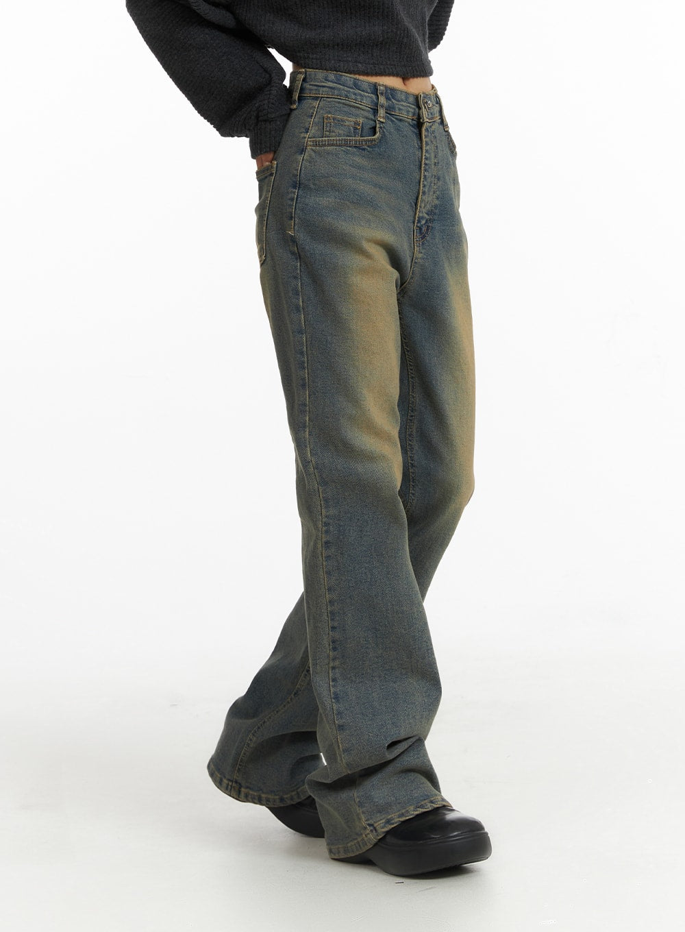 Washed Slim Fit Bootcut Jeans CJ431 in blue, angled side close-up on model from waist to hem, highlighting high-rise waistband, five-pocket detail, and exaggerated bootcut flare with golden wash fading.