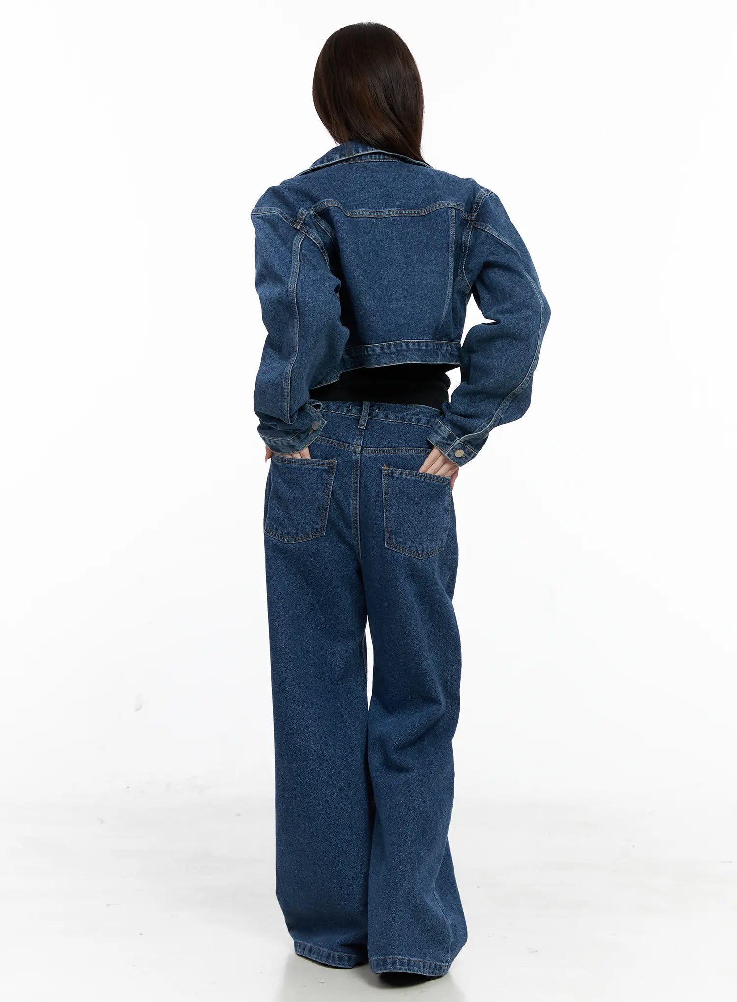 Eliza Seam Detail Relaxed Bootcut Jeans CO521 in washed blue, back full-length on model, paired with cropped denim jacket, dual back patch pockets with contrast stitching, relaxed loose fit.