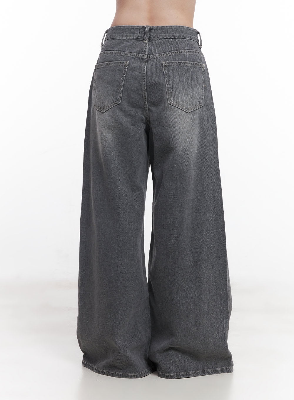 Beatriz Washed Wide-Leg Jeans CY519 in gray, back waist-down shot on model, dual back pockets with stitching detail, wide-leg washed denim, floor-grazing hem.