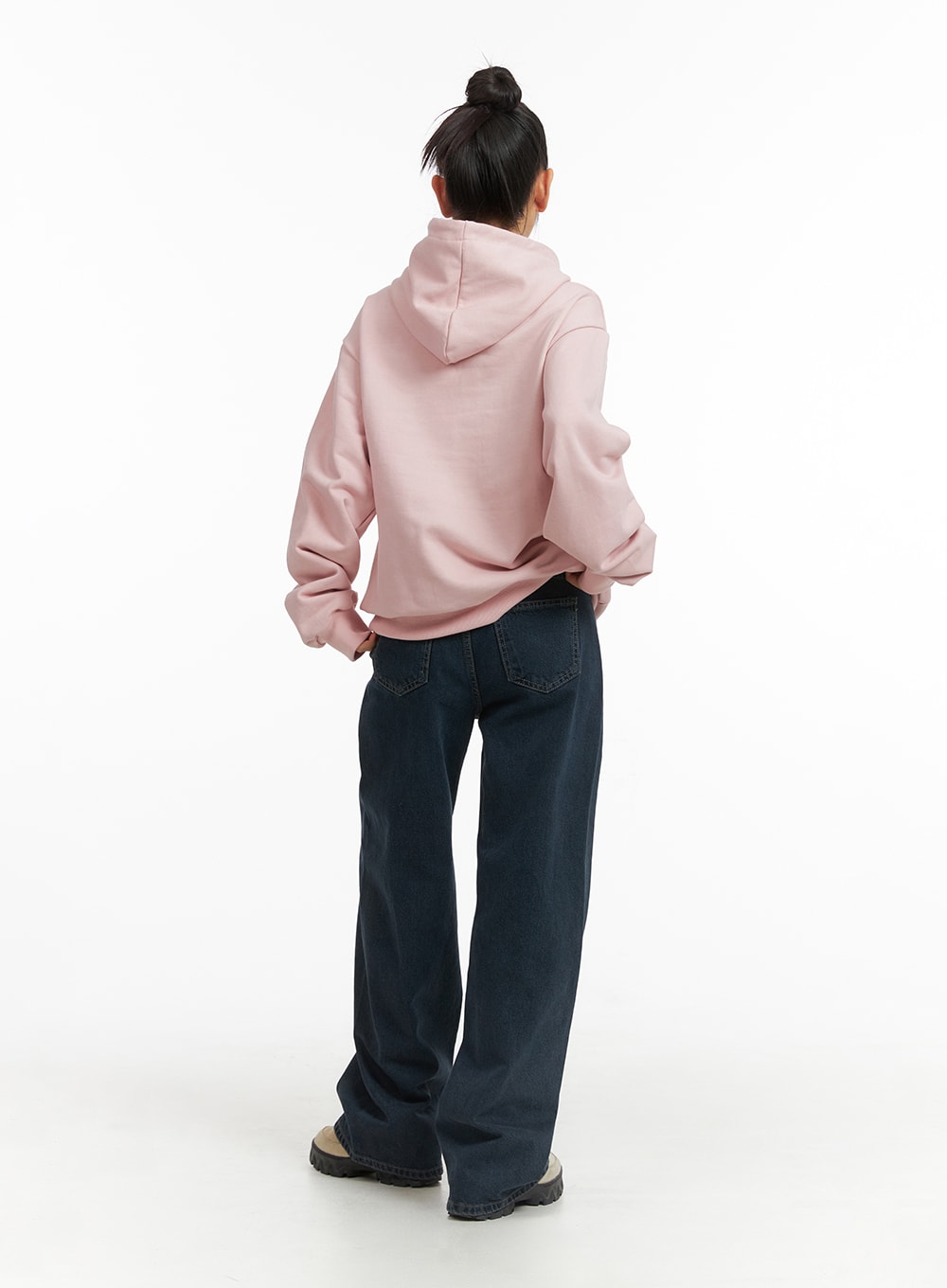 Washed Wide Leg Jeans CJ429 in dark blue, back full-body shot on model, showing wide leg silhouette and back patch pockets, paired with pink hoodie and chunky sneakers.
