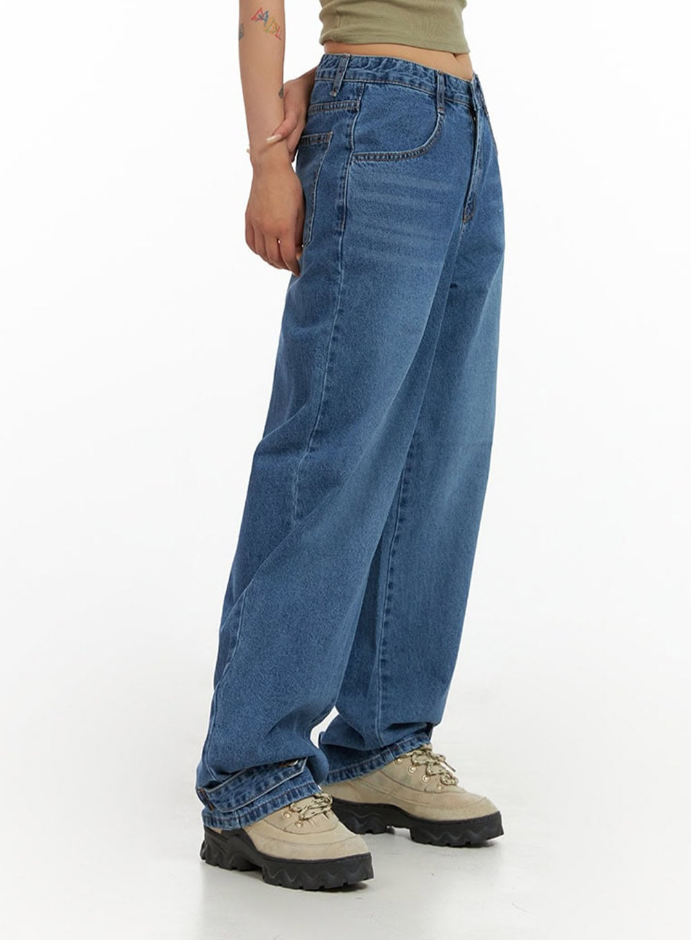 Wide Leg Baggy Jeans CL415 in blue, side close-up waist-to-hem shot on model, washed cotton denim with wide baggy leg and subtle fading, hem pooling over chunky sneakers.