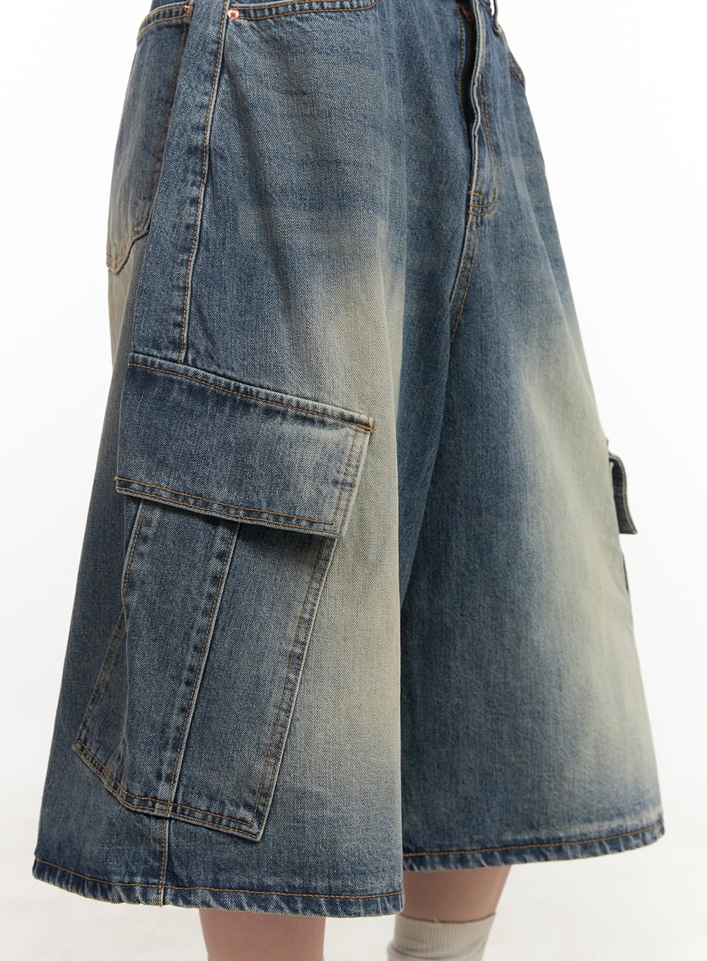 Cargo Bermuda Denim Shorts CF514 in dark blue, close-up side detail shot, flap cargo pocket with contrast stitching and washed denim texture highlighted, wide-leg silhouette.