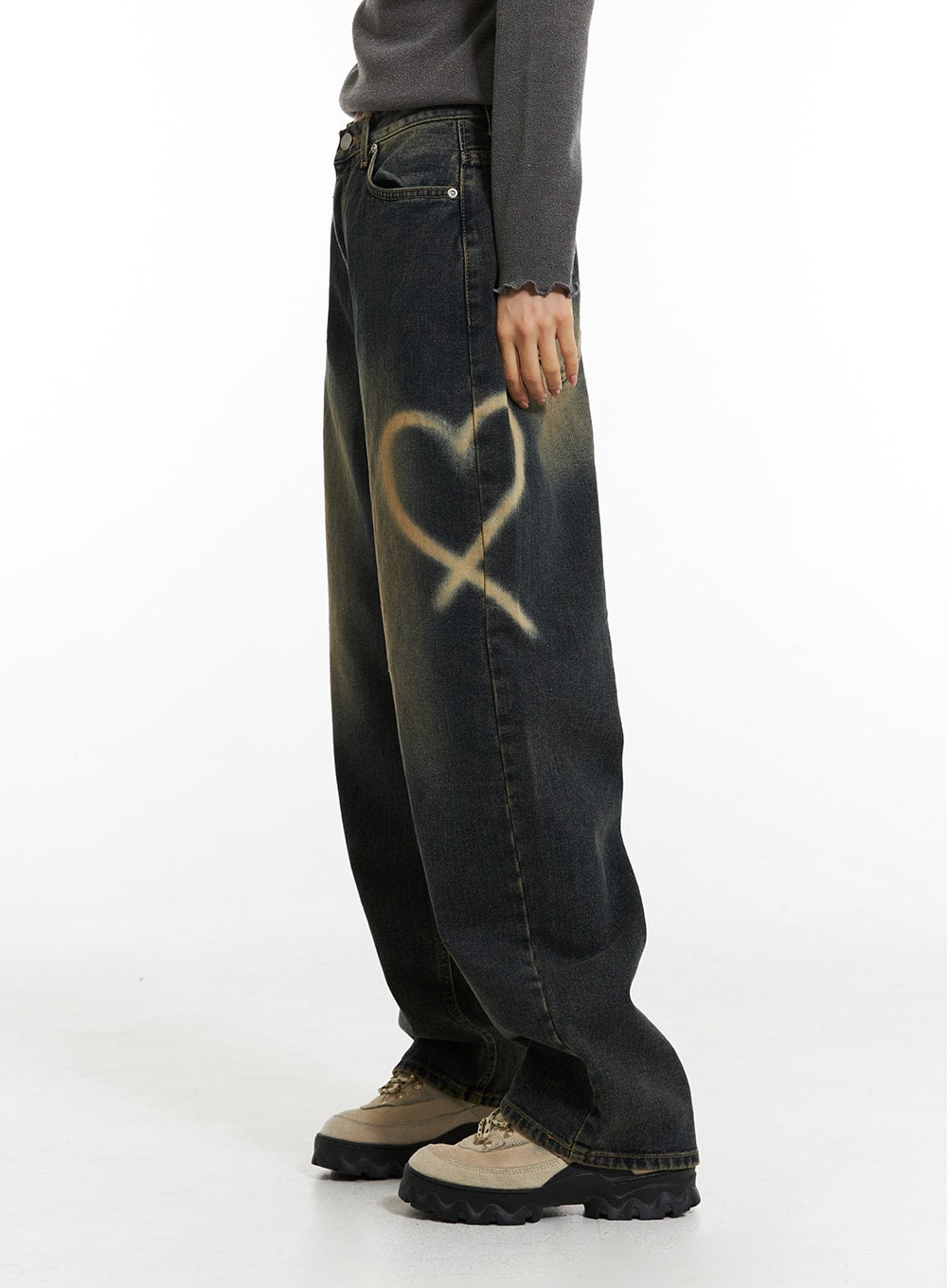 Heart-Bleached Wide Leg Jeans IN308 in dark blue, side close-up on model from waist down, spray-bleached heart graphic prominent on thigh, wide-leg cotton denim with golden fade wash.