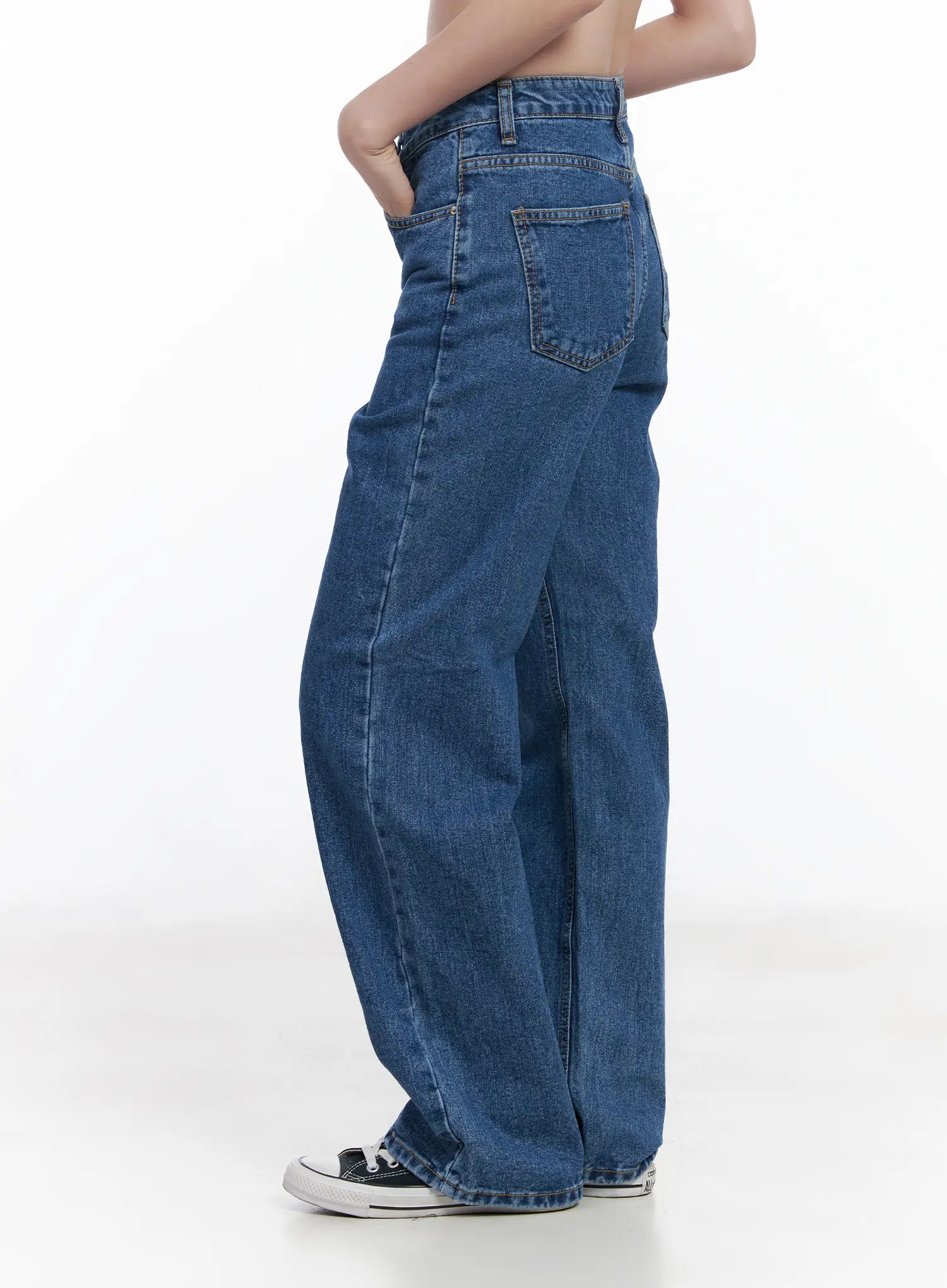 Aila Relaxed Fit Jeans CJ519 in blue, side product close-up on model, wide-leg washed cotton denim showing back pocket and relaxed hip silhouette.