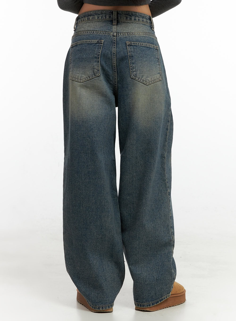 Peyton Pin-Tuck Washed Baggy Jeans CO424 in blue, back crop view on model, dual back pockets with washed fading and wide-leg hem pooling at floor, cotton denim construction.