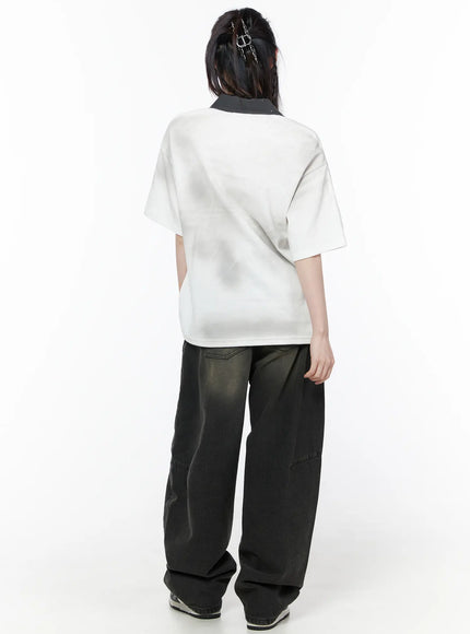 Oversized Collar Jersey CU519 in white, back view on model, clean plain back with contrast dark collar detail at neckline, relaxed drop-shoulder fit, paired with wide-leg dark jeans.