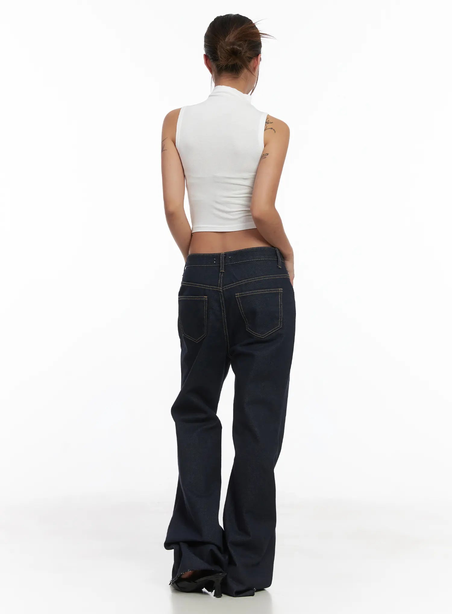 Bunn Non-Fade Eyelet Bootcut Jeans CJ512 in dark blue, back full-length shot on model, dual back pockets with contrast stitching, bootcut flare, paired with white sleeveless crop top.
