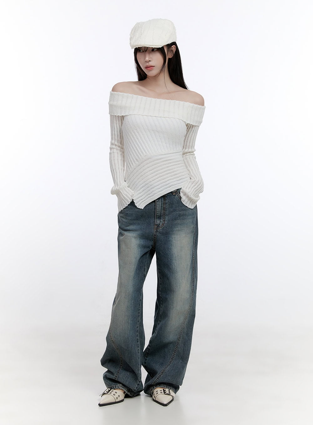 Lucia Stitched Denim Baggy Jeans CO418 in blue, full-body front shot on model with white beret, loose wide-fit washed denim with curved seam detail, acubi street styling.