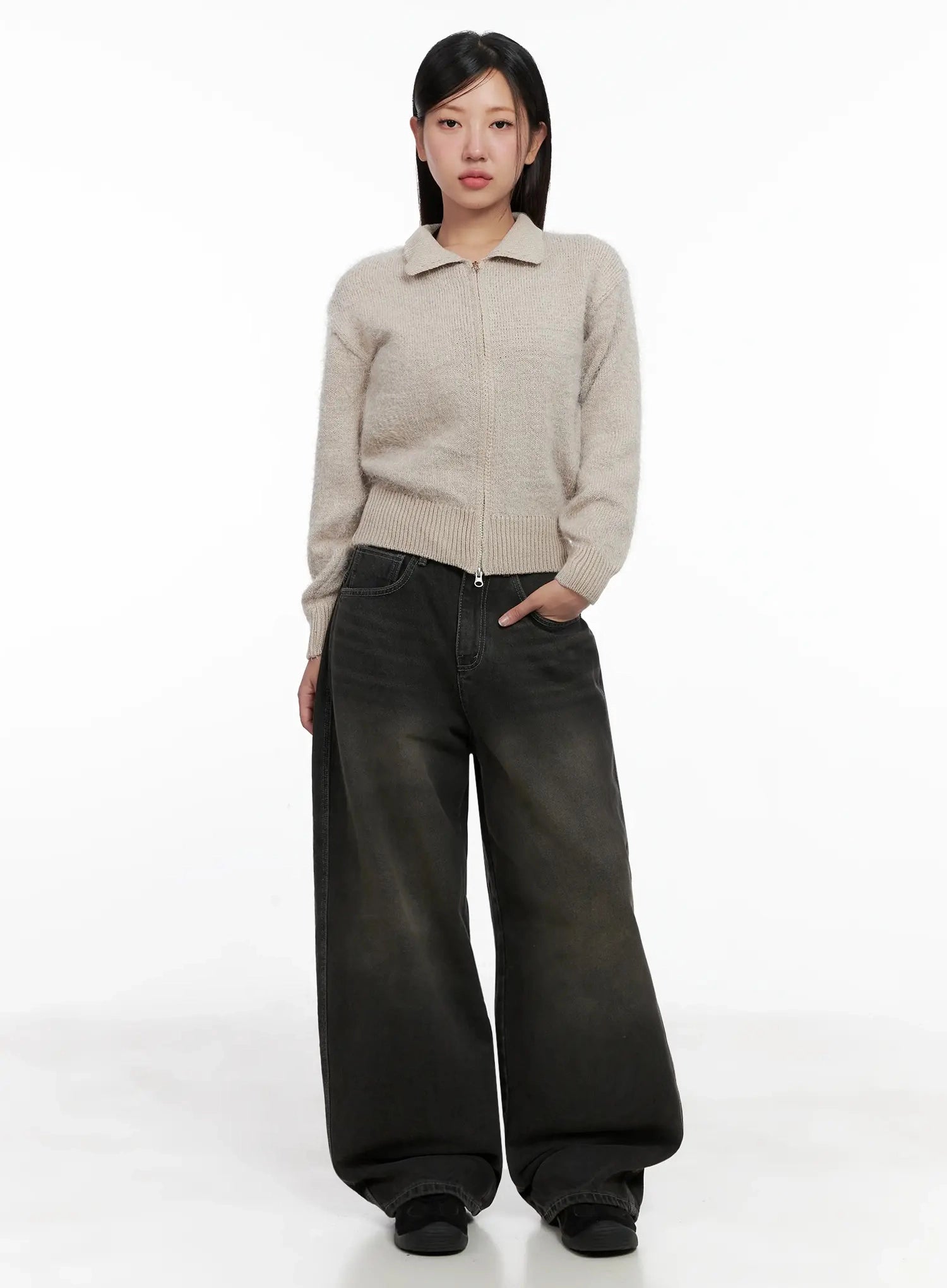 Hari Dark Washed Baggy Jeans IG527 in dark grey, full-length front shot on model, floor-grazing wide leg, styled with beige zip-up collar knit sweater, relaxed street silhouette.