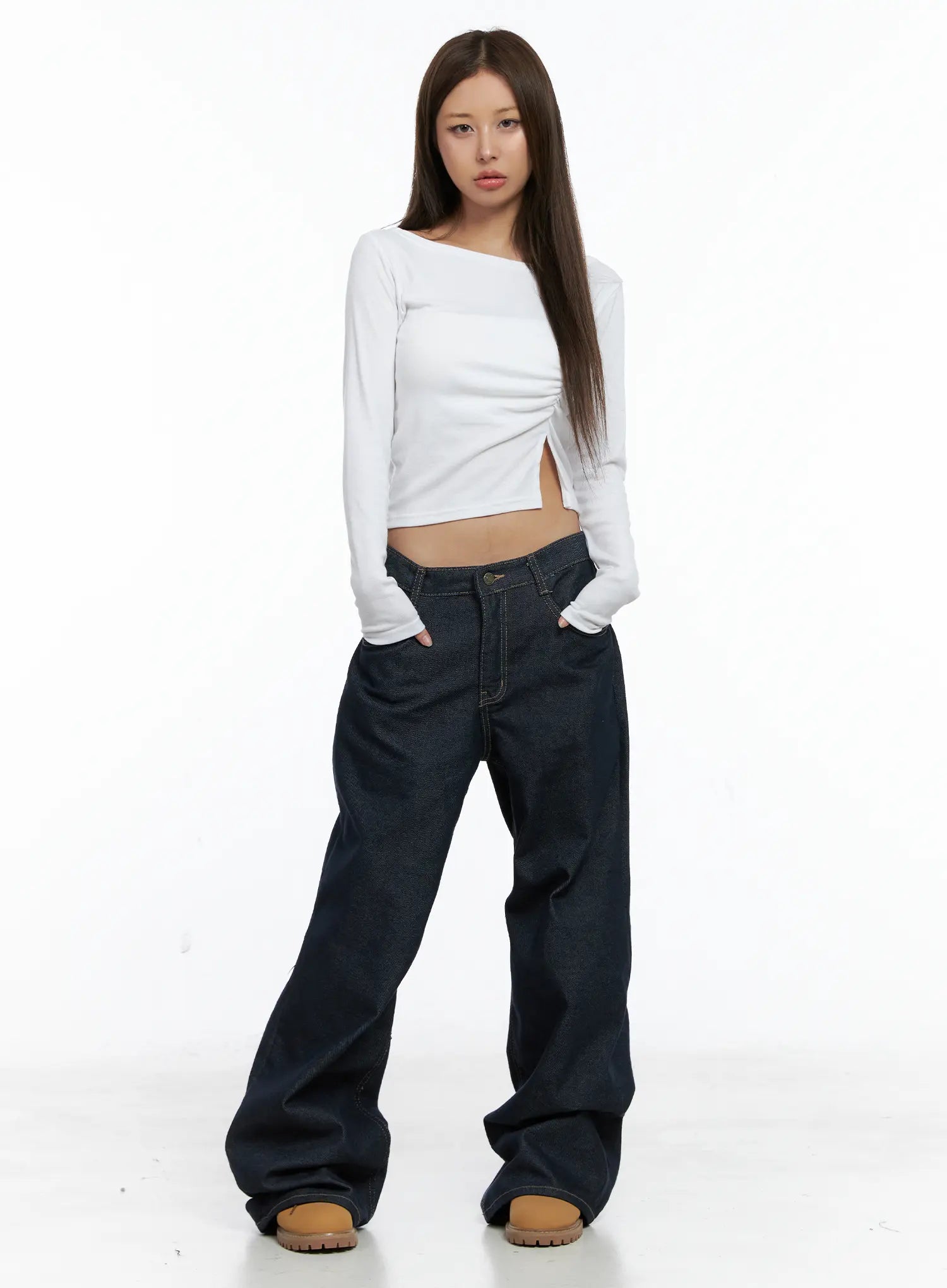 Giada Raw Indigo Wide-Leg Jeans CS505 in dark blue, front full-body shot on model facing camera, low-rise waist, wide-leg cotton denim, paired with white long-sleeve crop top.