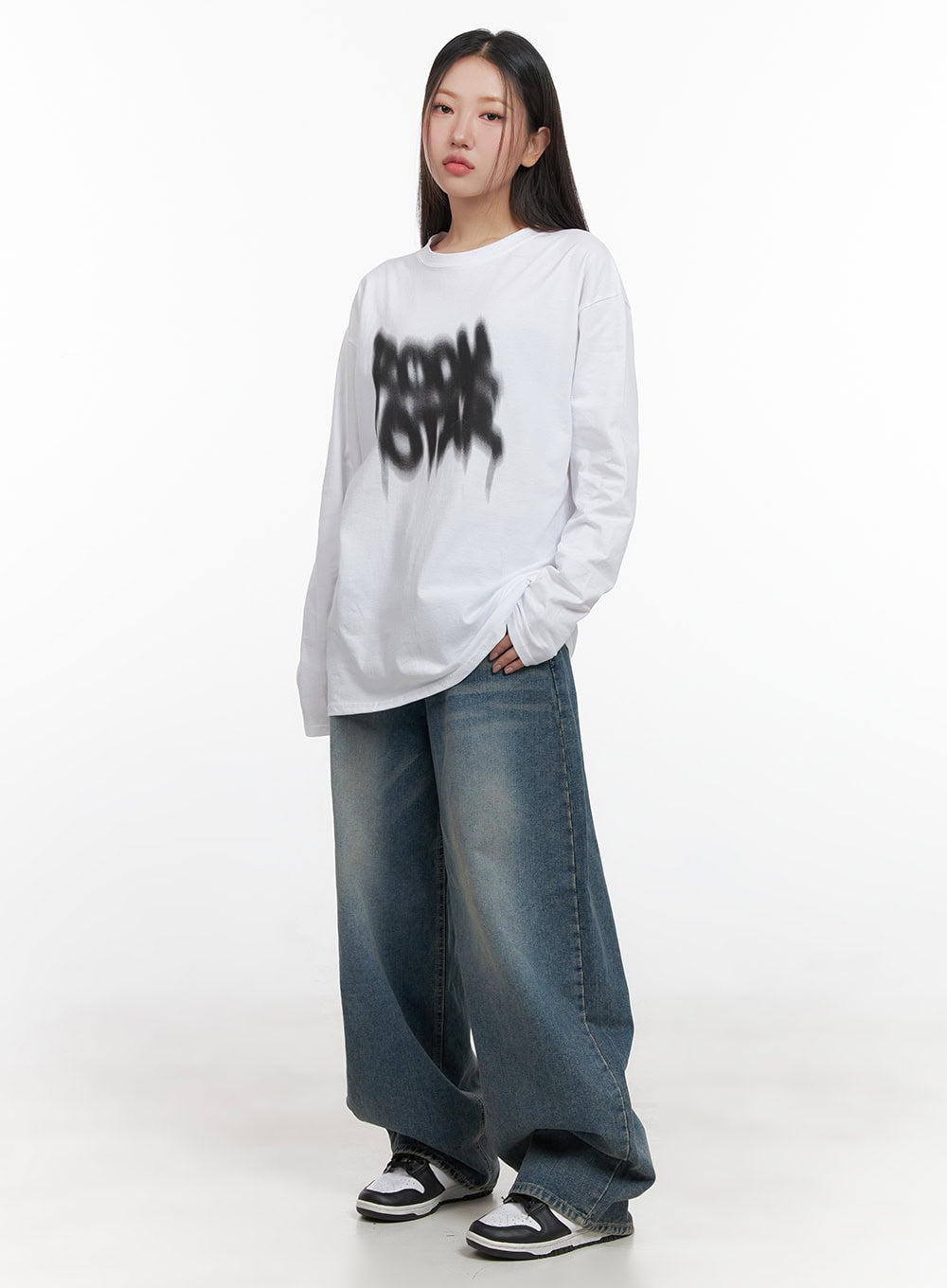 Mikaela Comfy Baggy Jeans CD411 in blue, front full-body on model, washed baggy denim with wide balloon legs, styled with oversized graphic long-sleeve tee and sneakers.