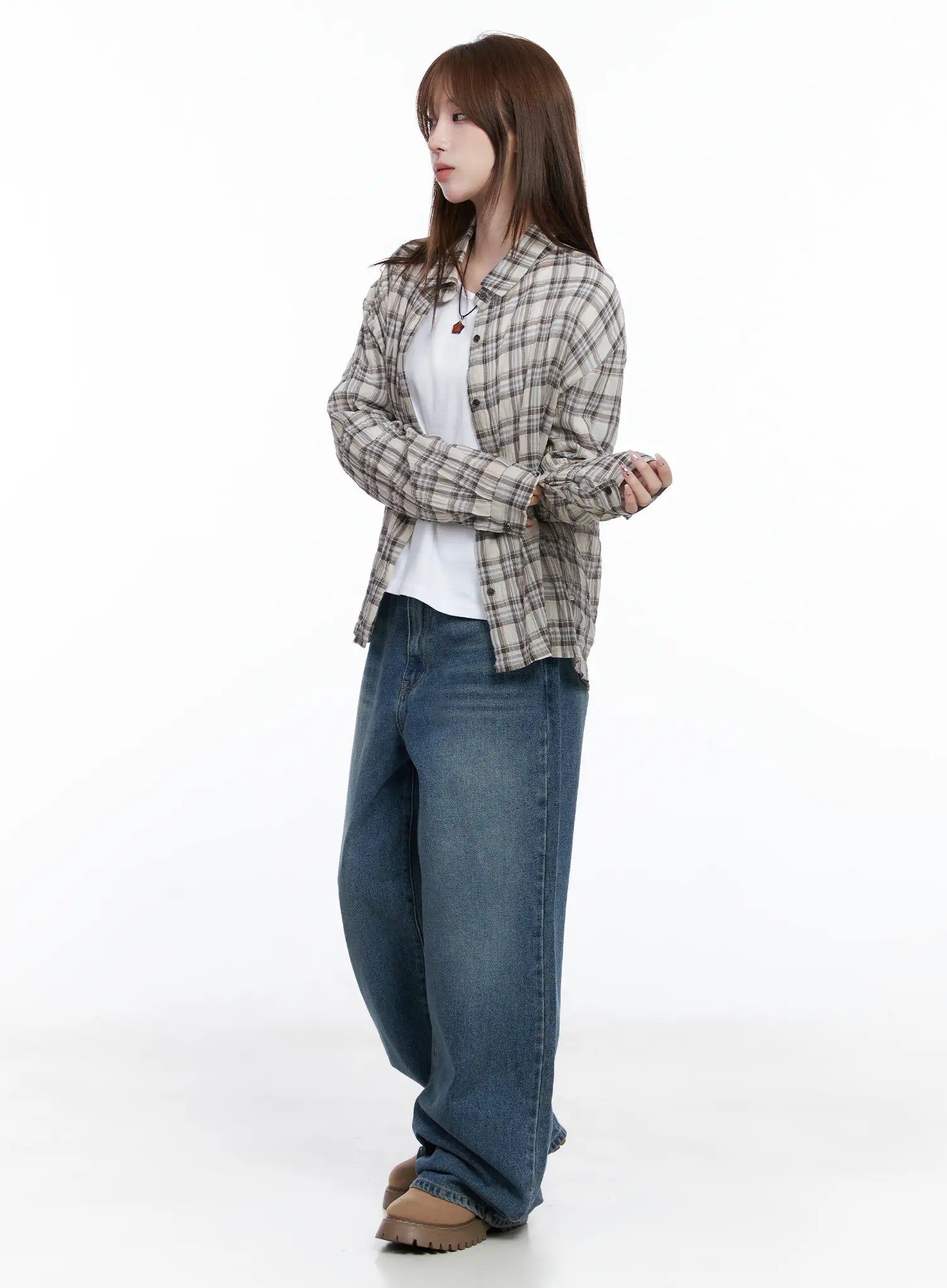 Amalia Wide Leg Vintage Washed Jeans CG529 in blue, full-body side shot on model styled with open plaid shirt layered over white tee, arms crossed, acubi street casual look.