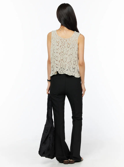 Basic High-Waist Stretch Flared Slacks CU522 in black, back full-length view on model, smooth tailored finish, flared hem draping to floor, styled with crochet tank and black tote.