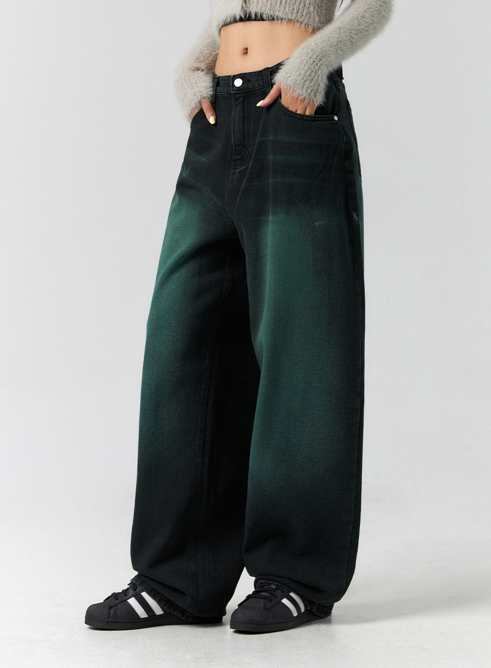 Comfy Wide Leg Color Jeans CS305 in dark green, front three-quarter side close-up on model, hands in pockets showing waistband and deep green gradient wash across wide leg denim.