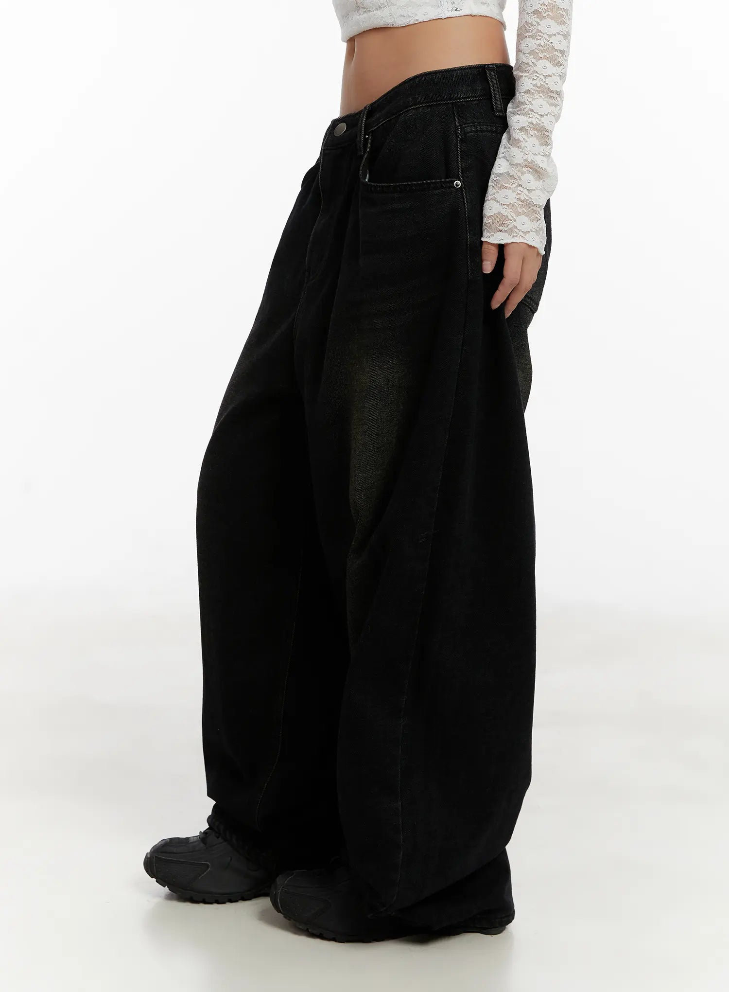 Myla Dark Wash Wide-Leg Jeans CD512 in dark black wash, side view close-up on model, highlighting ultra-wide leg sweep and dark-to-olive washed fading, worn with white lace crop top.