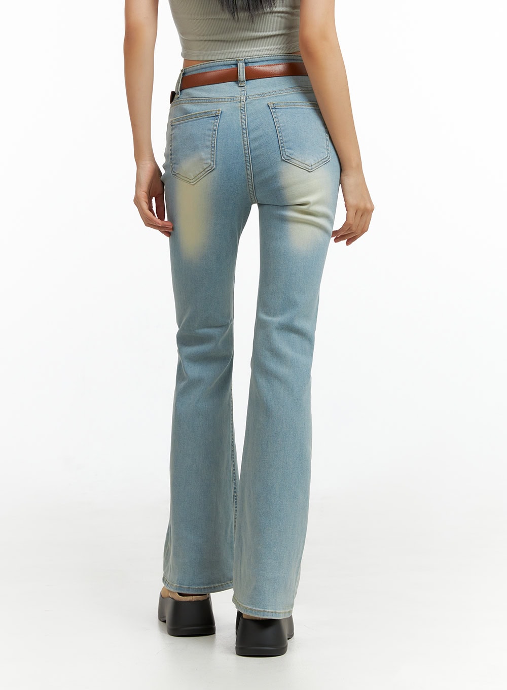 Light Washed Slim Fit Bootcut Jeans IL409 in light blue, back view on model, dual back pockets, washed fading on seat, slim fit through hips with bootcut flare, brown belt.