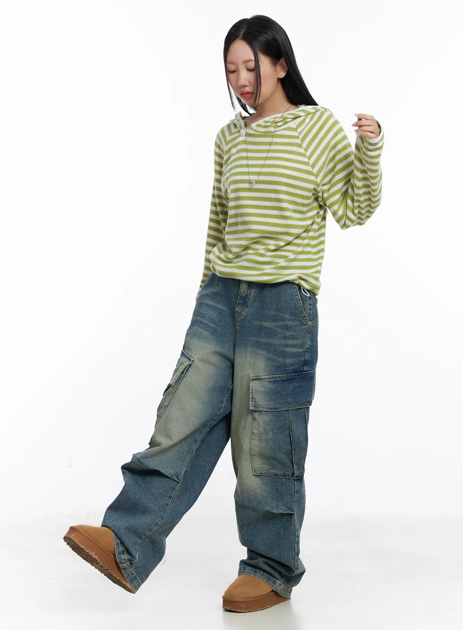 Jake Wide-Leg Cargo Jeans CJ515 in blue, three-quarter front shot on model in motion, styled with green striped hoodie and tan platform boots, showcasing oversized wide-leg cargo silhouette.