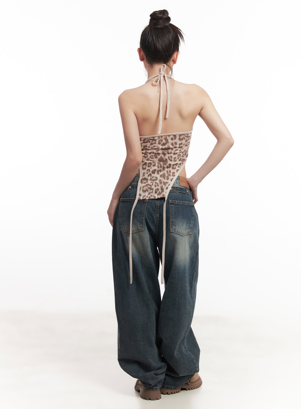 Leilani Washed Baggy Jeans CM531 in dark blue, back full-body view on model, wide-fit washed denim with dual back pockets and extra fabric pooling, paired with leopard halter.