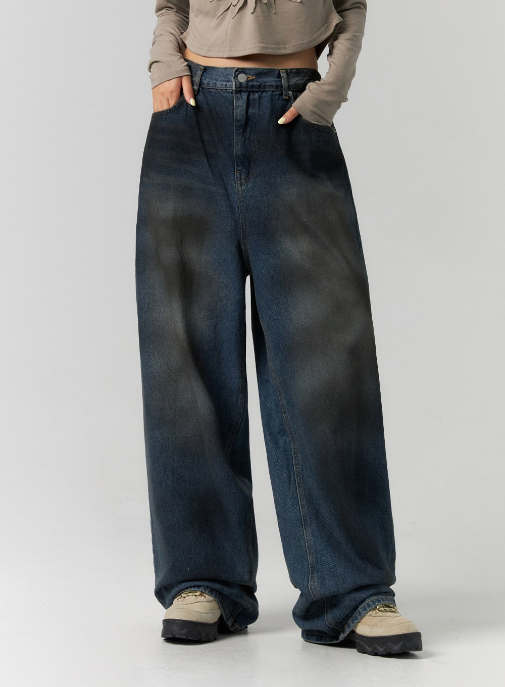 Tie-Dye Washed Wide Leg Jeans CS320 in dark blue, front mid-body close-up on model, highlighting tie-dye washed pattern, mid-rise waistband and roomy wide leg with front crease.