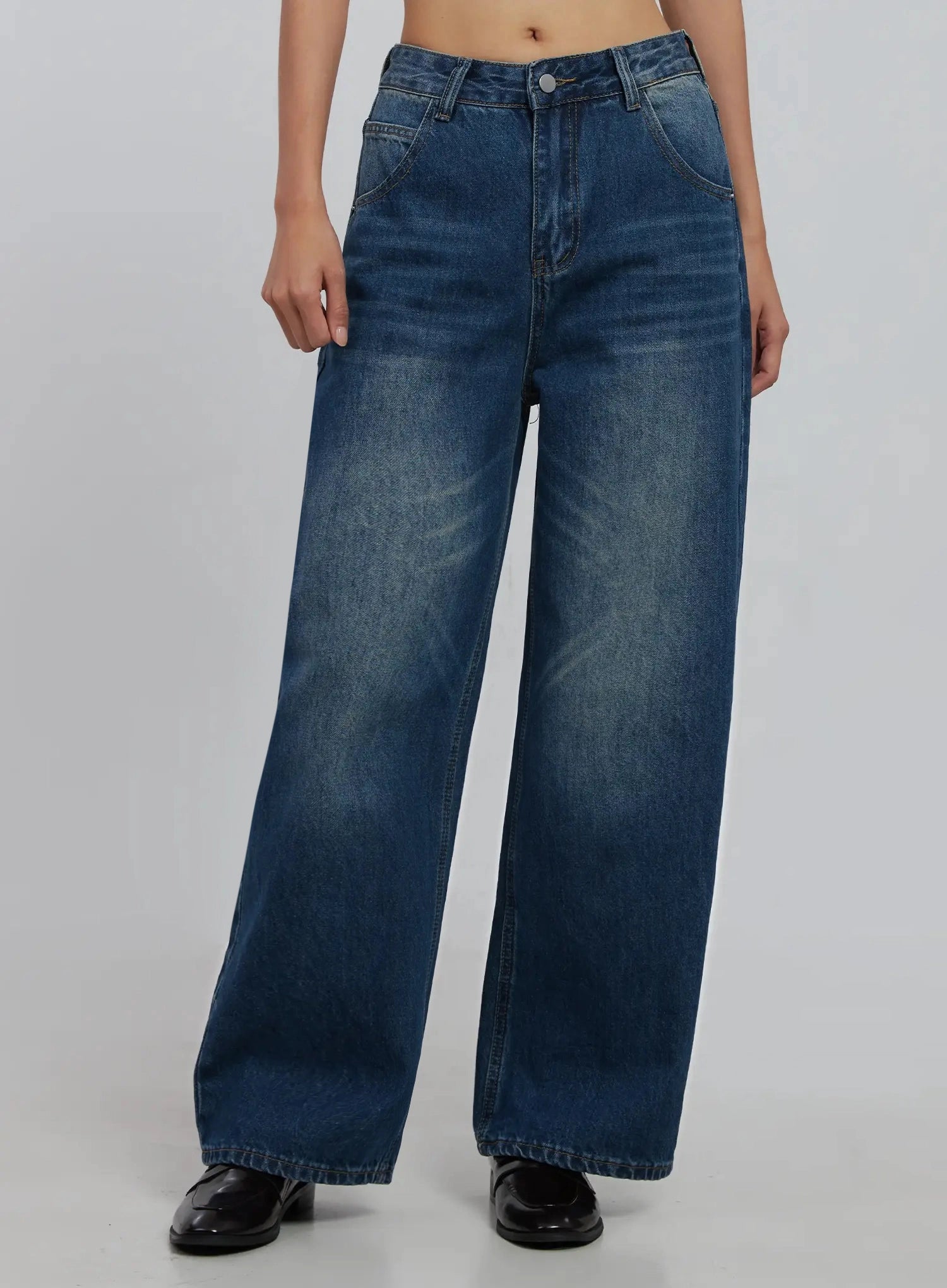 Alaina Wide Leg Jeans IJ508 in dark blue, front crop view on model, slightly lighter washed finish, wide straight leg from hip to hem, belt loops and front pockets.