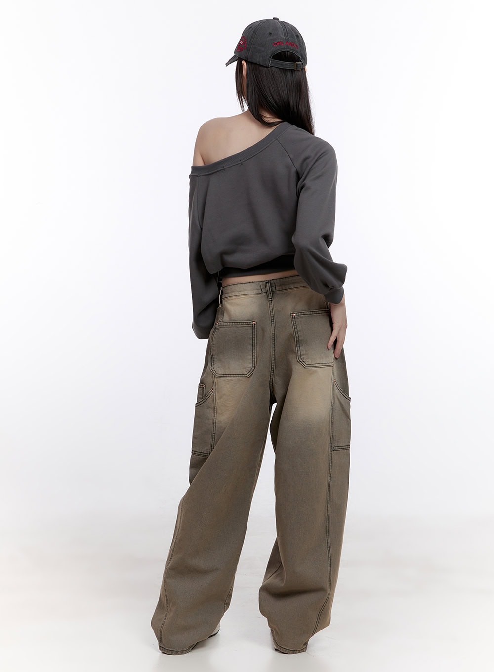 Sara Stitched Pocket Baggy Jeans CF512 in Beige, back full-length view on model, washed denim showing large rear patch pockets with contrast stitching, paired with off-shoulder sweatshirt.