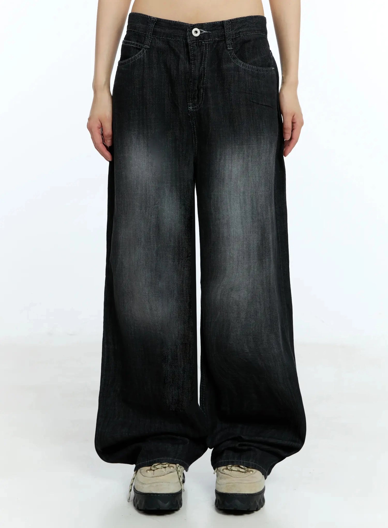Wendy Washed Wide-Leg Jeans IU524 in black, front product shot on model from waist to hem, washed fading detail, five-pocket styling, extra-wide leg with voluminous hem pooling over sneakers.
