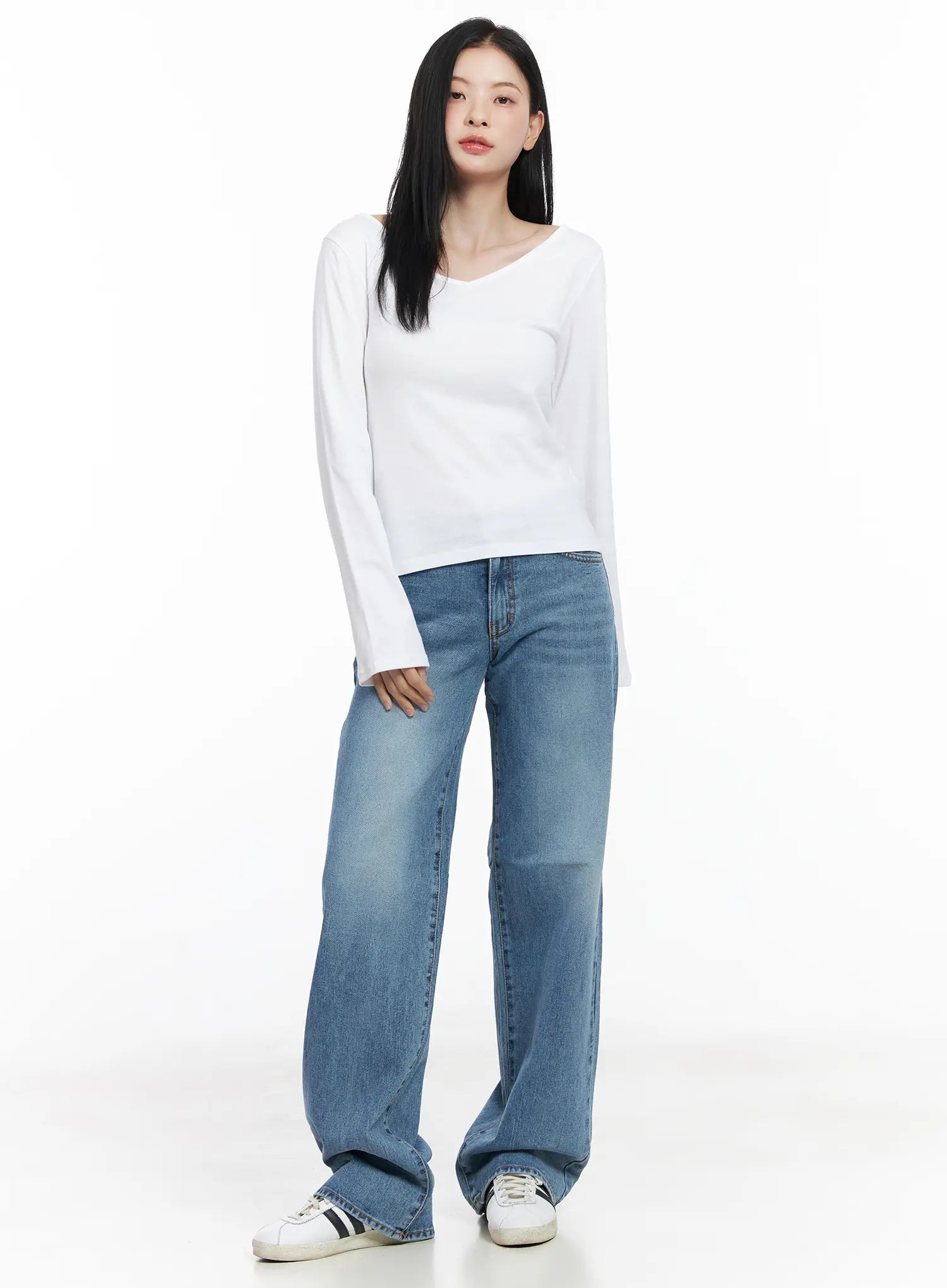 Maisy Casual Wide Leg Jeans CJ519 in blue, full-body front view on model standing straight, long washed cotton wide-leg fit, styled with white long-sleeve top and sneakers.