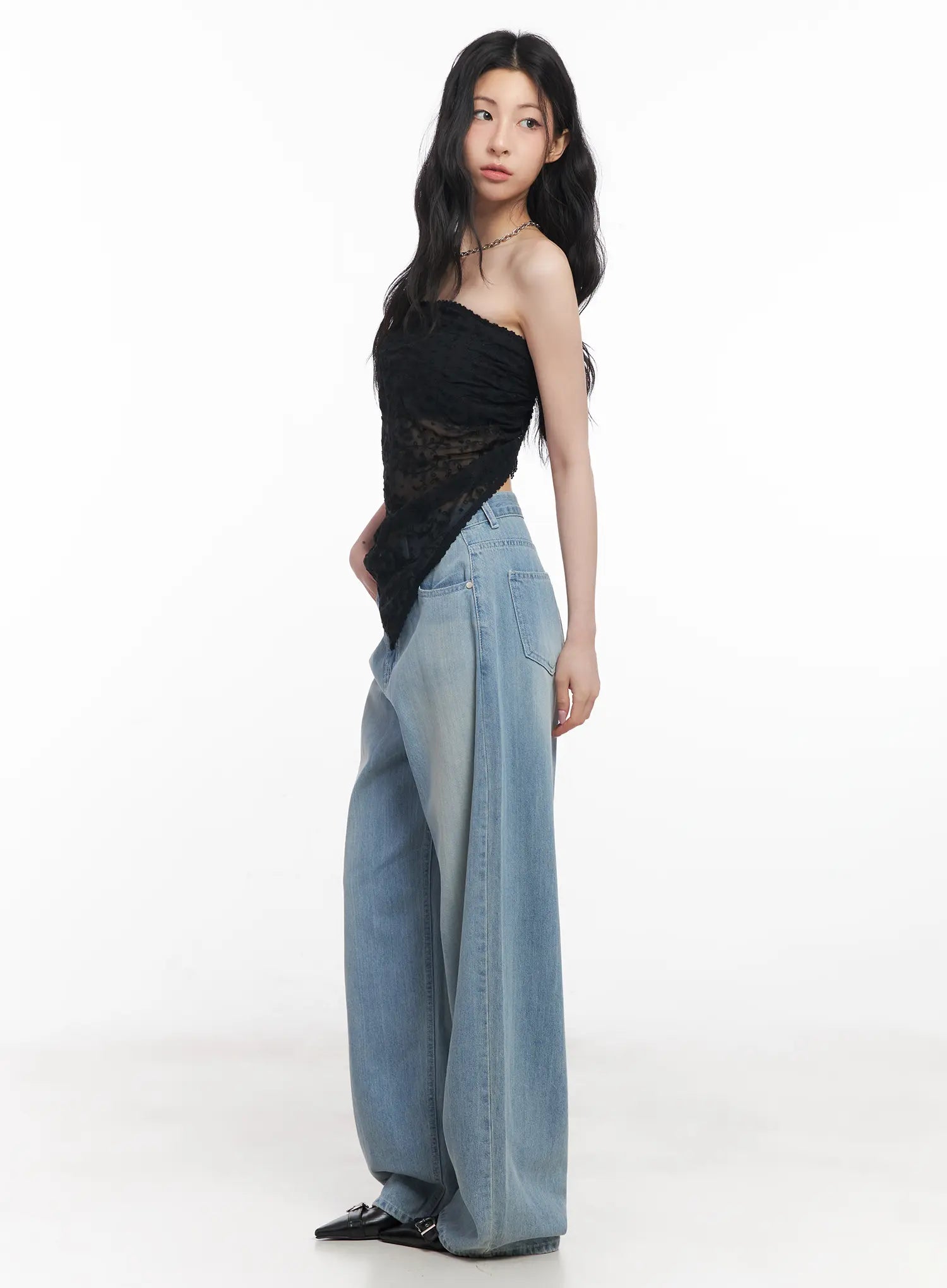 Rose Washed Baggy Summer Denim Jeans CU511 in light blue, full-length side view on model, wide-fit washed denim paired with black sheer lace strapless top and black heels.