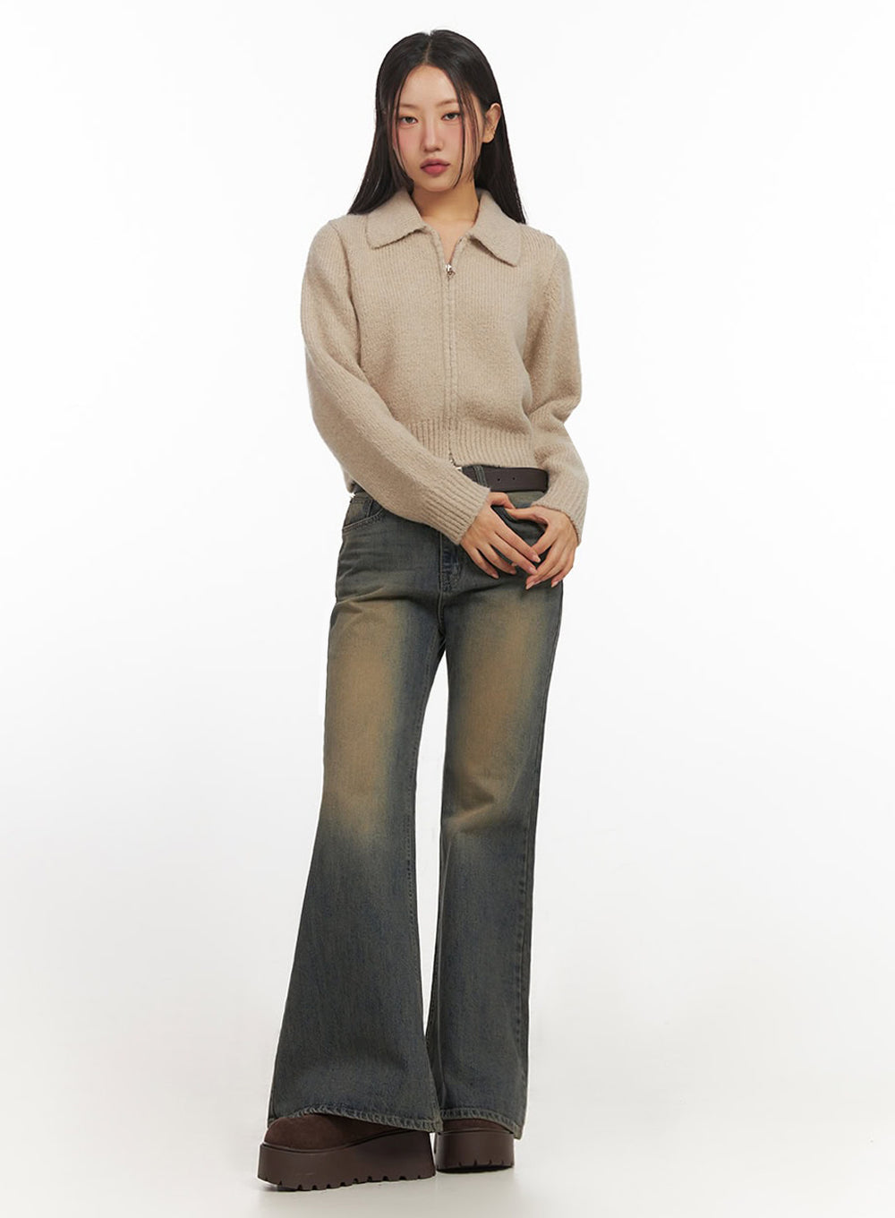 Kourtney Vintage Wash Flared Jeans IF510 in dark blue, full-length slight-angle shot on model, slim-fit wide flare leg denim with amber vintage wash, styled with beige knit top and brown platform boots.