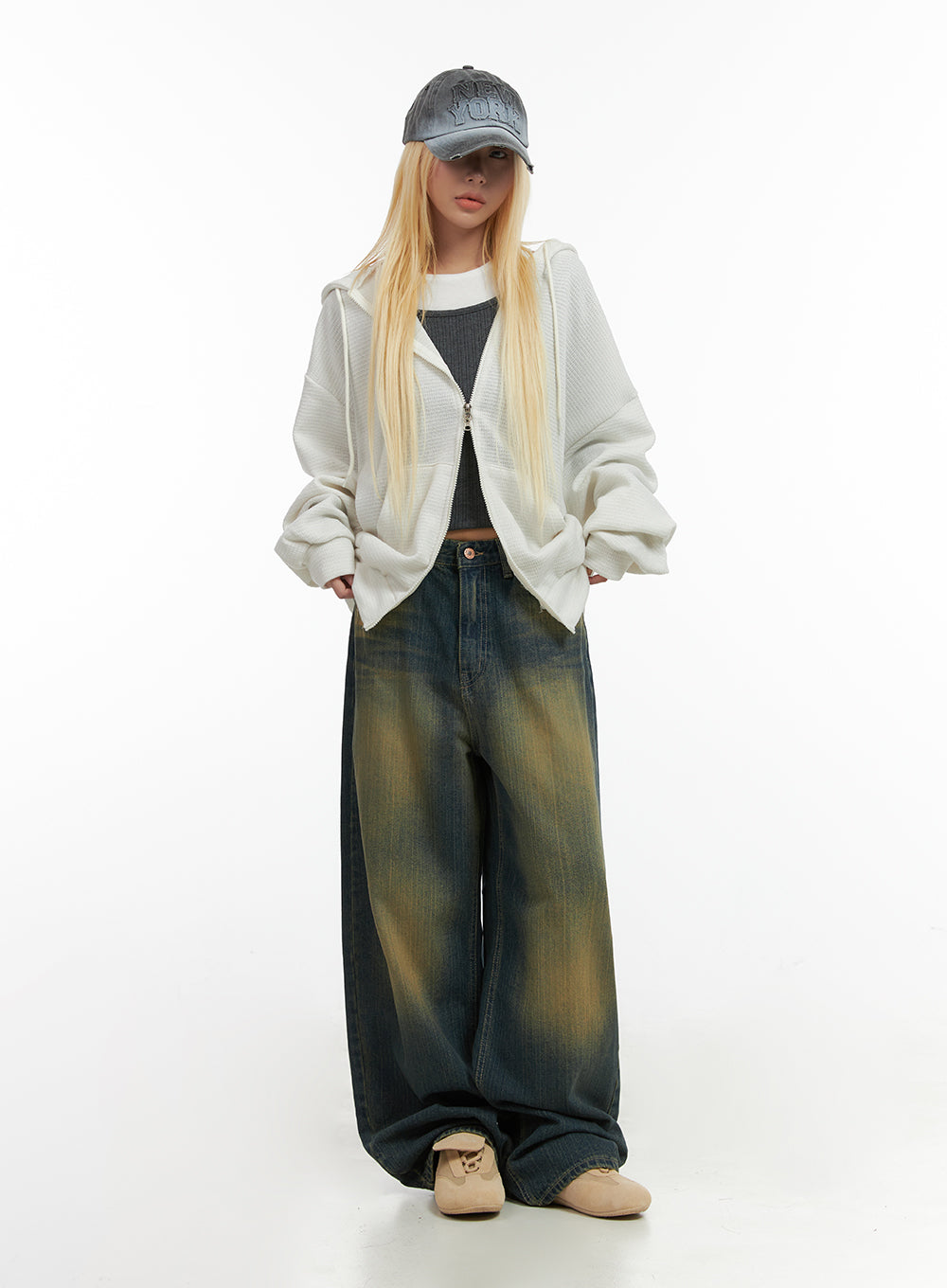 Georgia Vintage Wash Baggy Denim Jeans CO414 in dark blue, full-body front shot styled with white zip-up hoodie, grey crop top, and grey baseball cap, street acubi look.