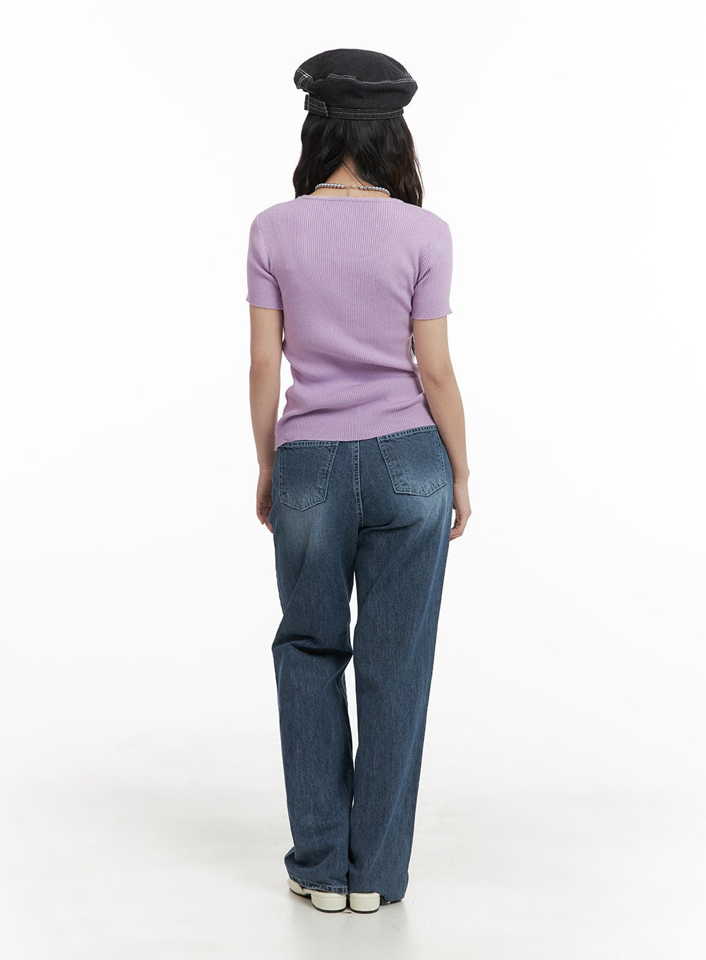 Recycled Light Washed Straight Jeans OM425 in blue, back view full-length on model, rear patch pockets on washed denim, paired with lavender ribbed top and baker boy hat.