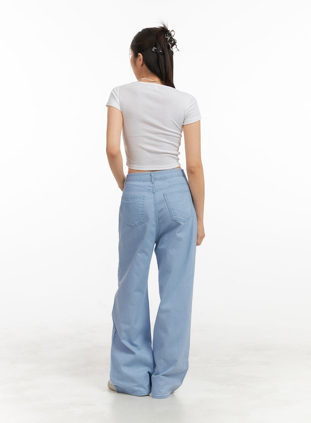Solid Cotton Loose Fit Straight Jeans OA429 in light blue, back view full-length on model, back patch pockets, wide straight leg with floor-grazing hem, cotton solid denim.