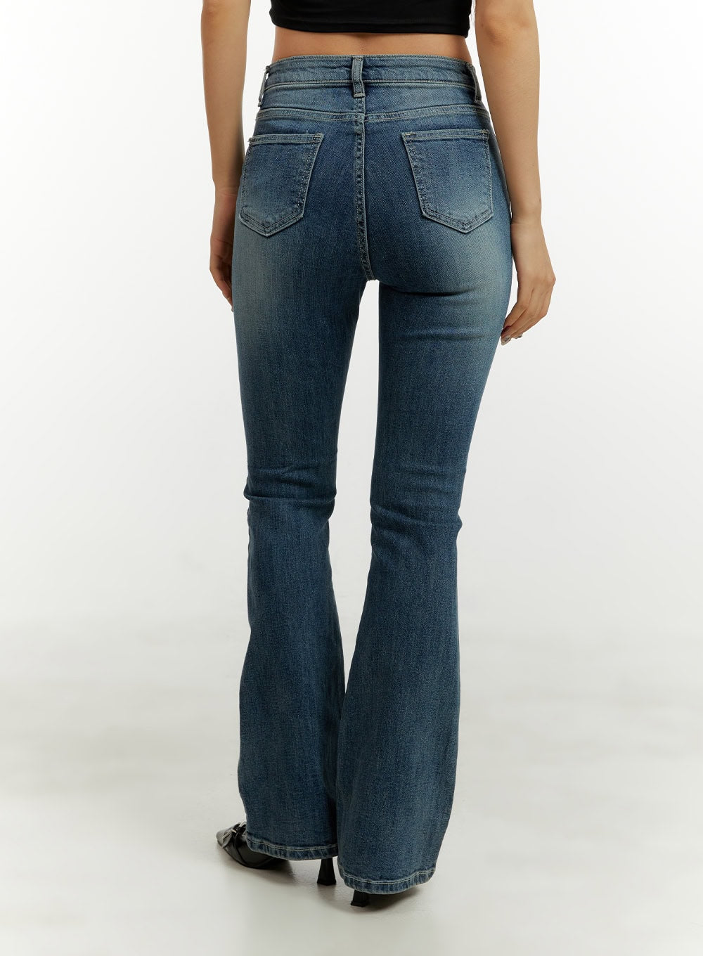 Low Rise Bootcut Jeans CY409 in blue, back view on model without top, showing back pockets, washed fading, and flared hem silhouette.