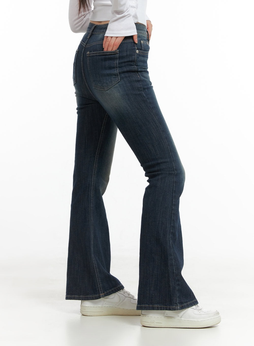 Remy Washed Bootcut Jeans CG420 in blue, side close-up on model, hip-to-hem angle showing slim fit through thigh and bootcut flare, back pocket and contrast stitching visible.