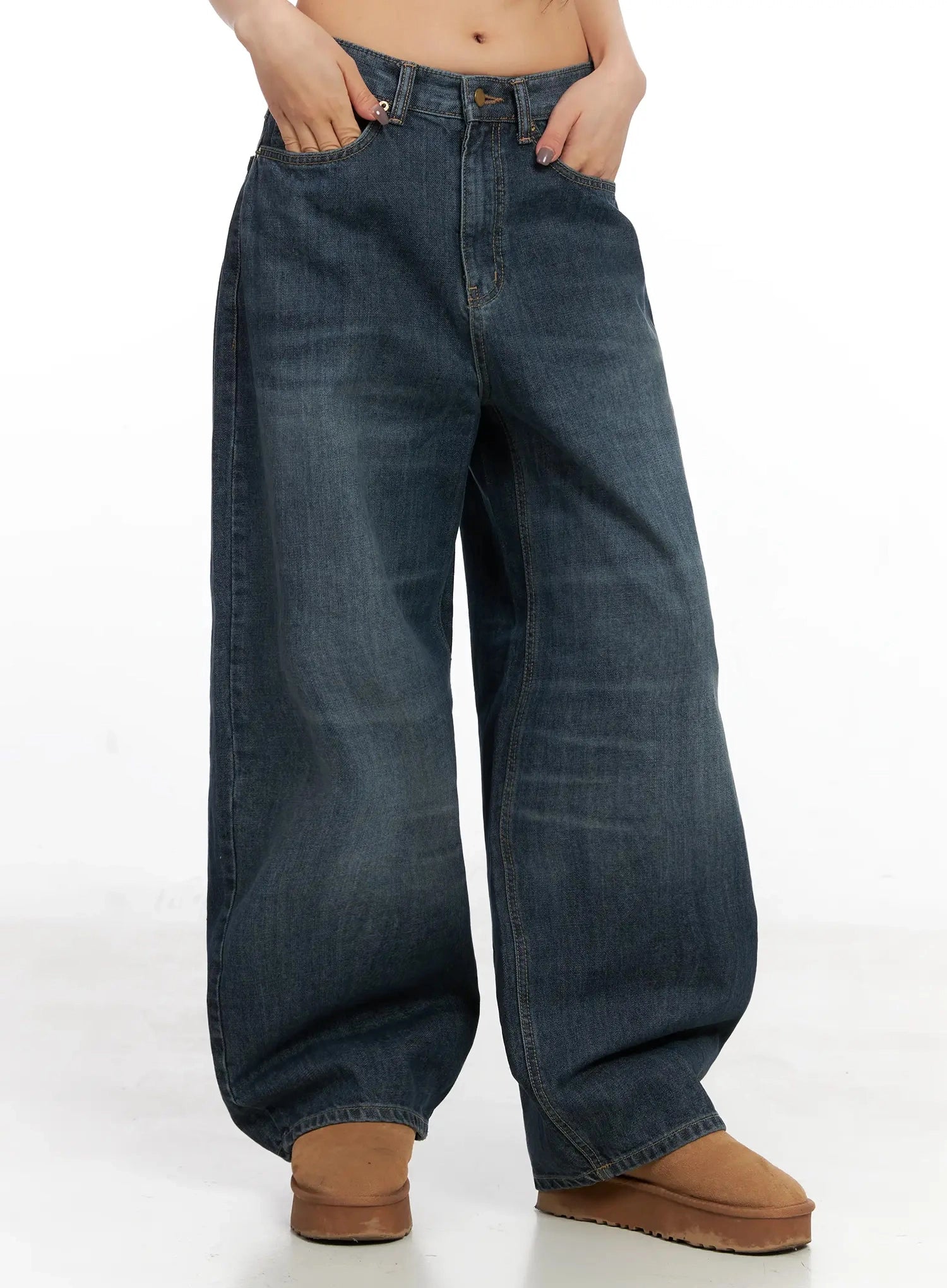 Regina Contrast Stitch Baggy Jeans IN528 in dark blue wash, cropped front close-up on model, wide-fit washed cotton denim showing waistband, front pockets, and voluminous leg silhouette.